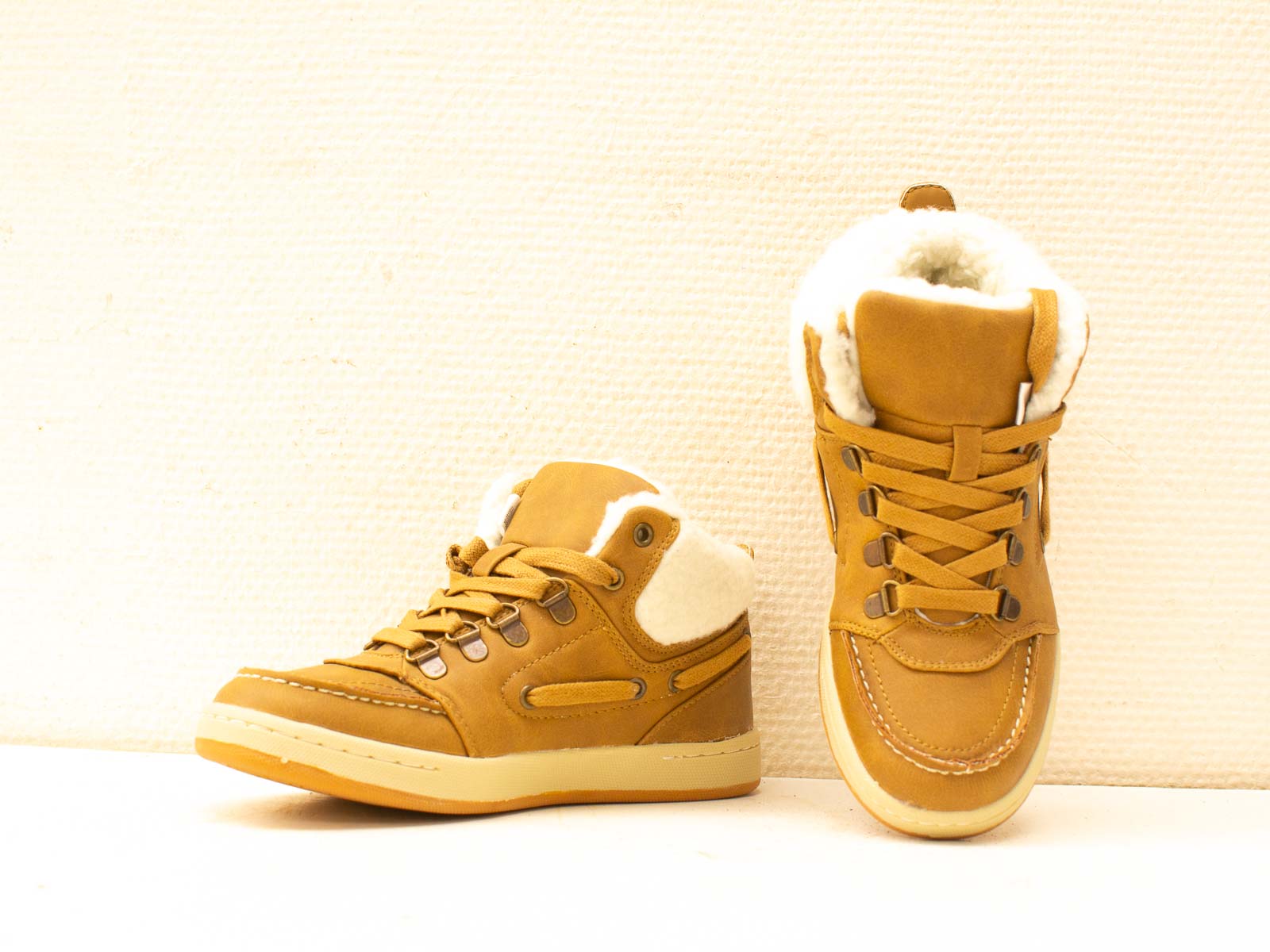 Trendy mustard yellow high-top sneakers for stylish comfort and versatile autumn outfits.