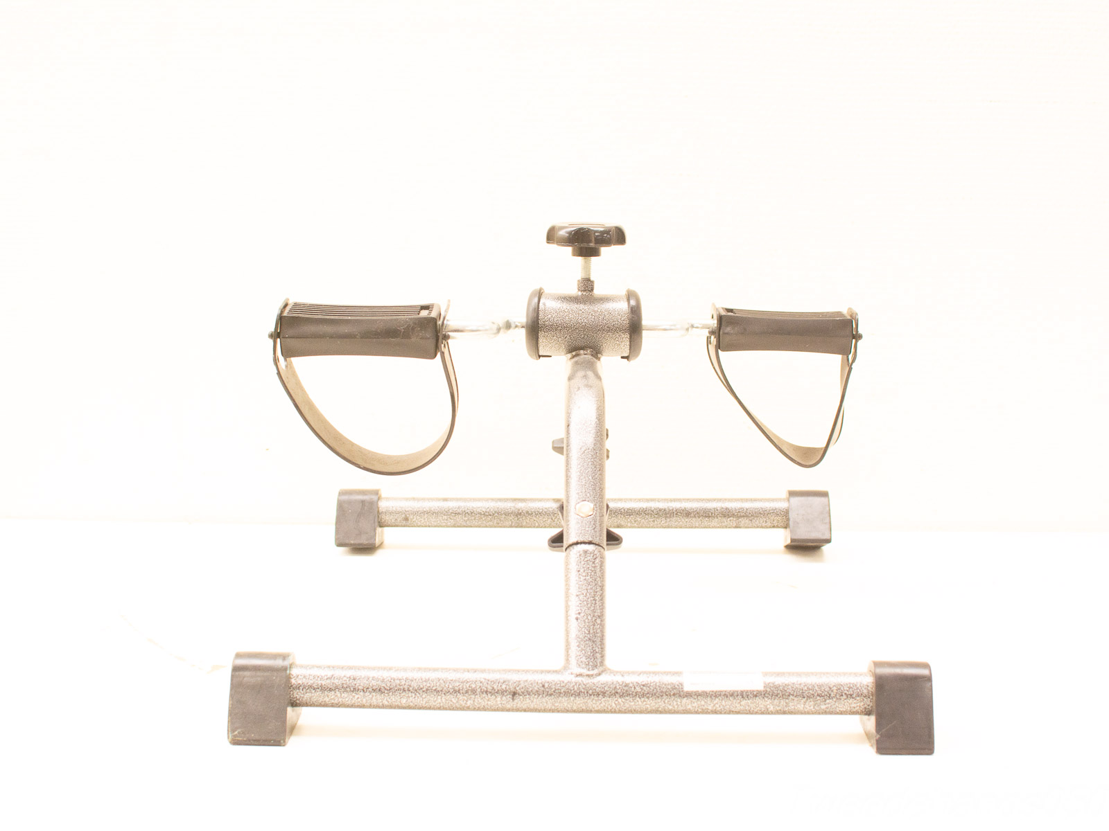 Compact vintage pedal exerciser for home workouts, adjustable resistance, ideal for all fitness levels.