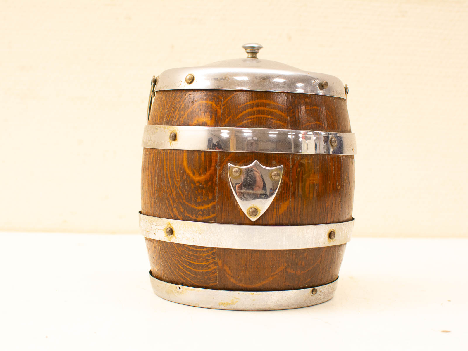 Charming vintage wooden barrel with metal accents, perfect for rustic decor and historical charm.