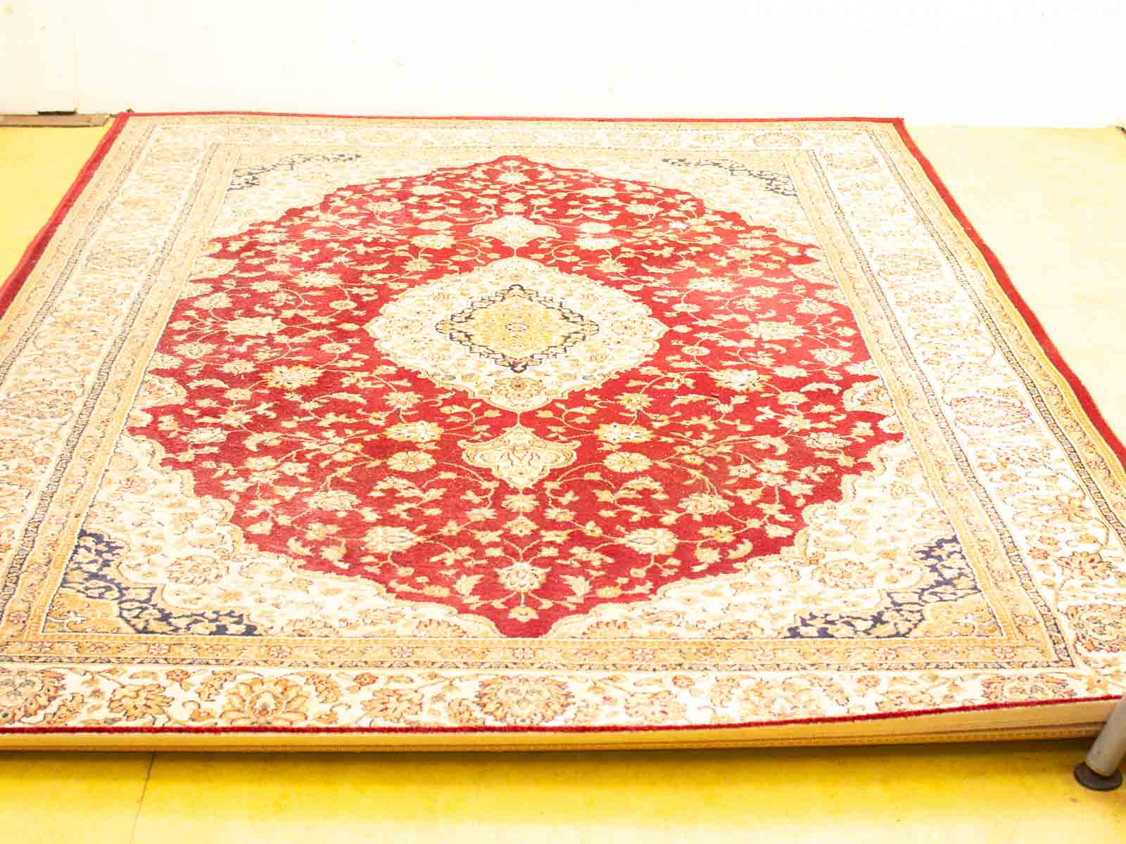 Elegant vintage red floral rug with intricate patterns, perfect for enhancing home decor.