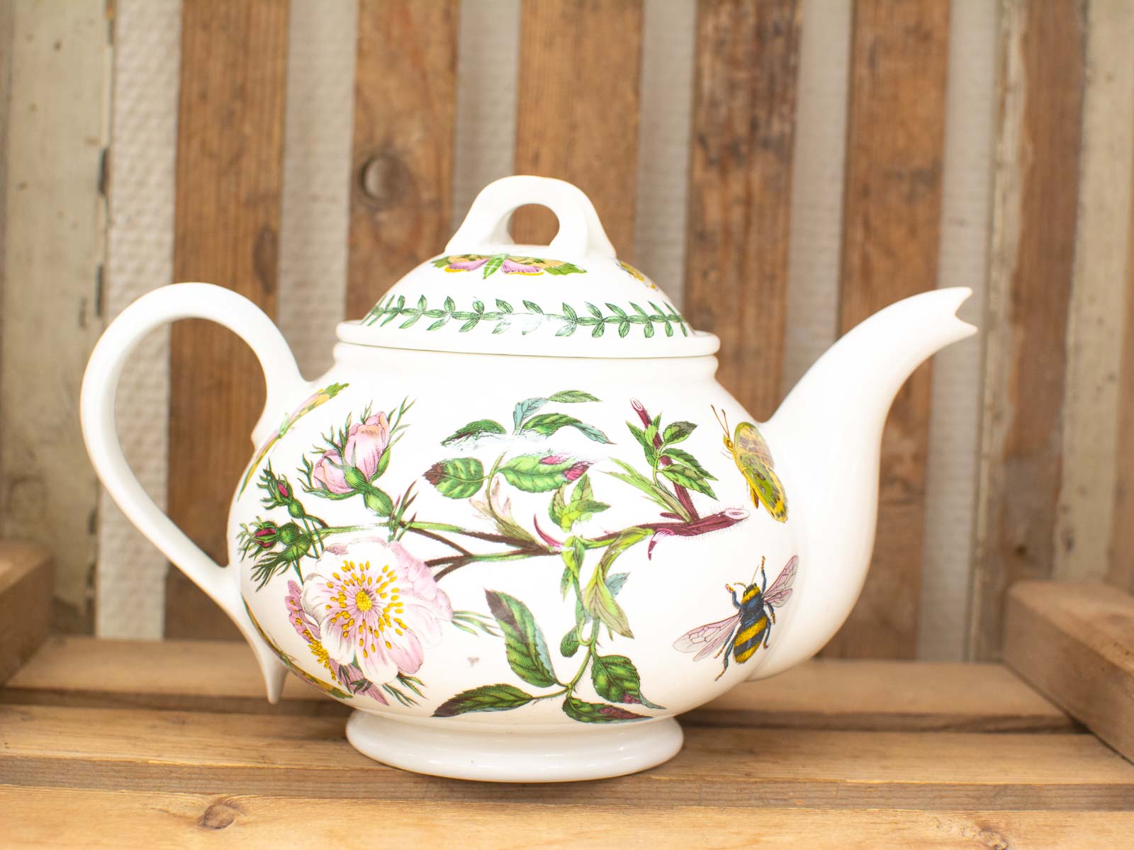 Elegant hand-painted porcelain teapot with floral designs, perfect for tea lovers and gatherings.