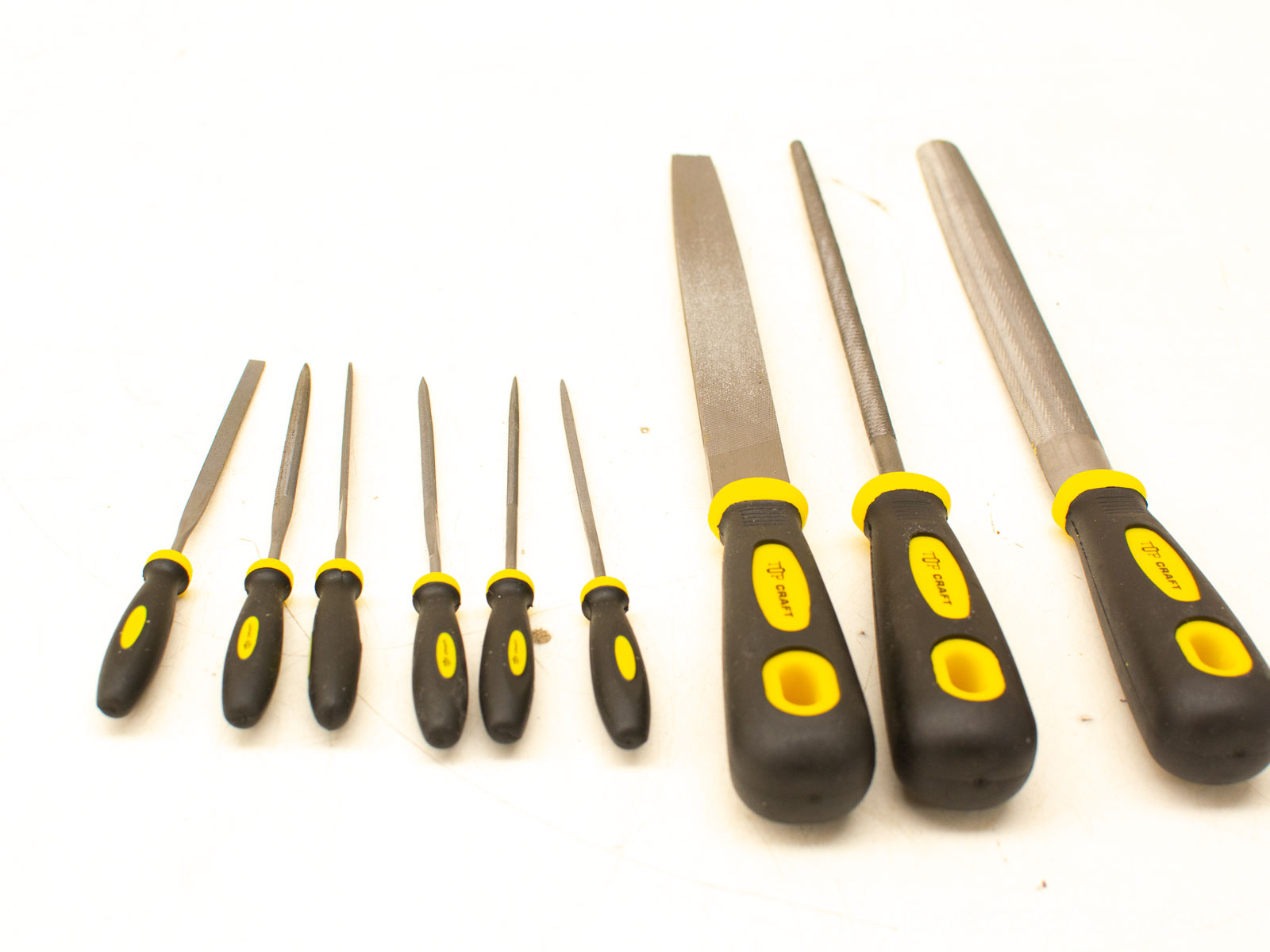 Ergonomic file set with yellow accents for precise shaping of wood, metal, and plastic.