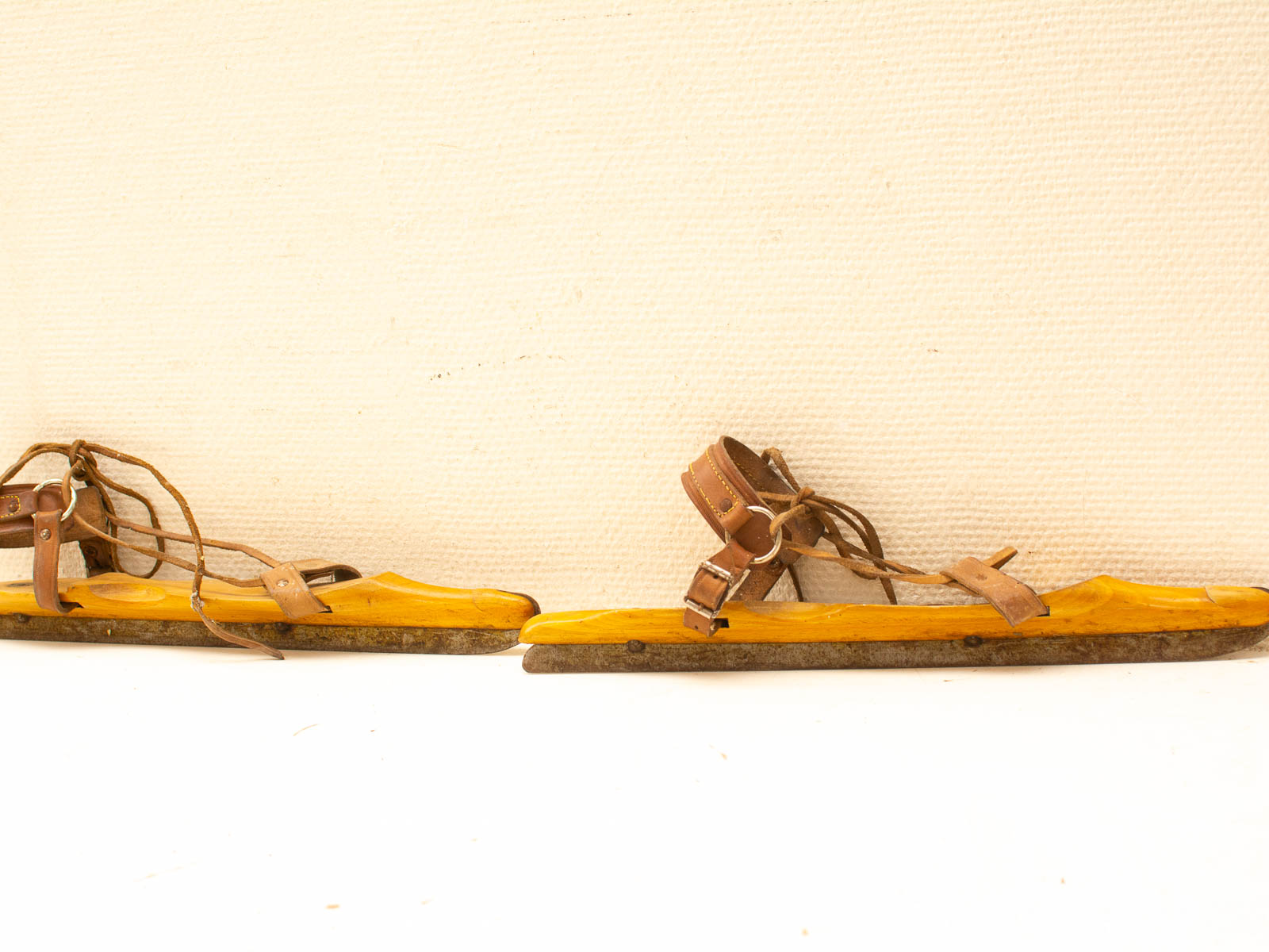 Vintage wooden sandals with leather straps, blending comfort, style, and traditional craftsmanship.