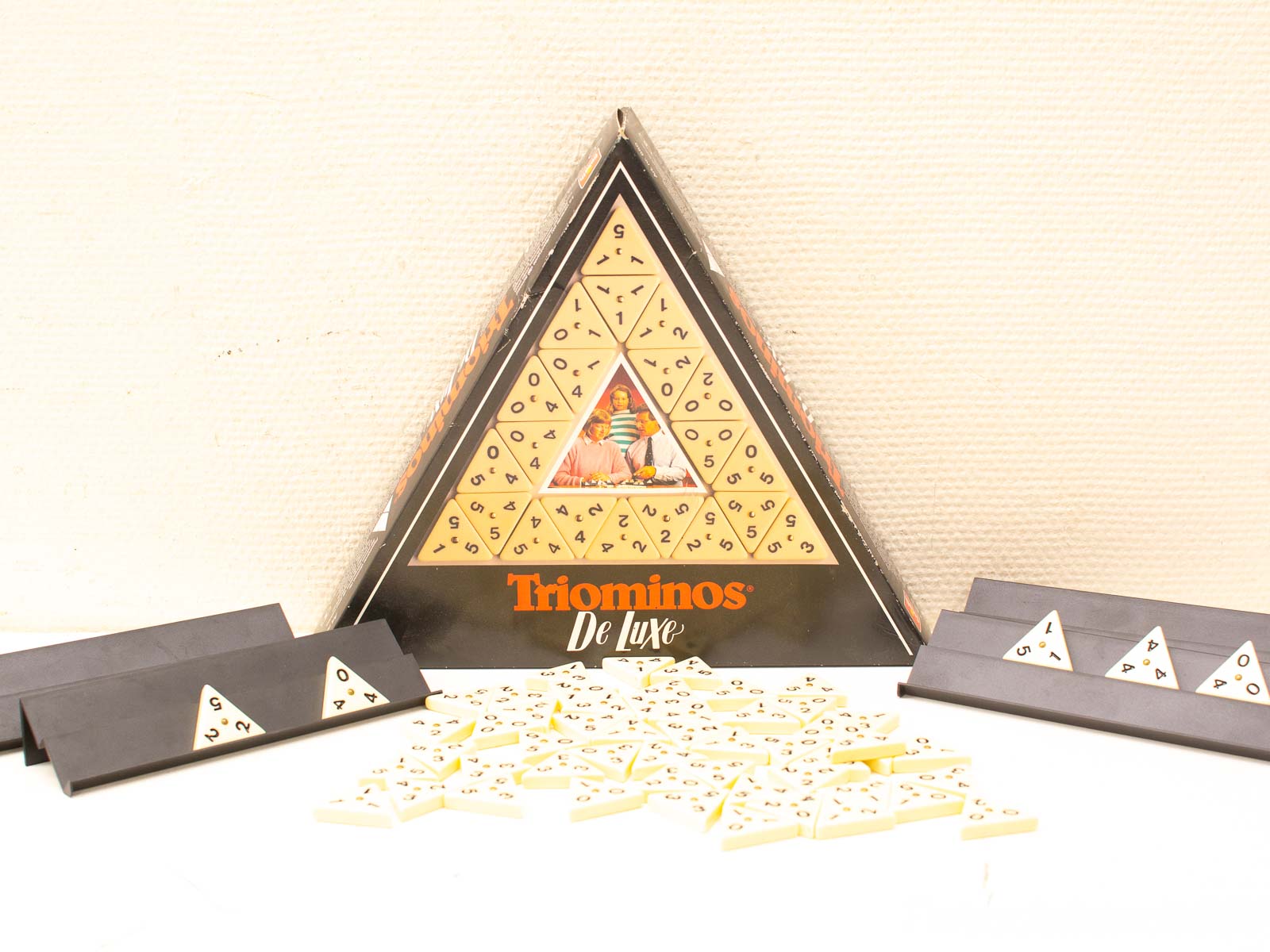 Triominos De Luxe: Strategic triangle game for fun social play with matching numbers.