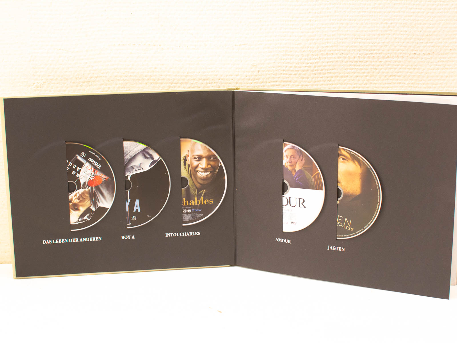 Curated DVD collection featuring acclaimed films, stunning artwork, perfect for film enthusiasts and collectors.