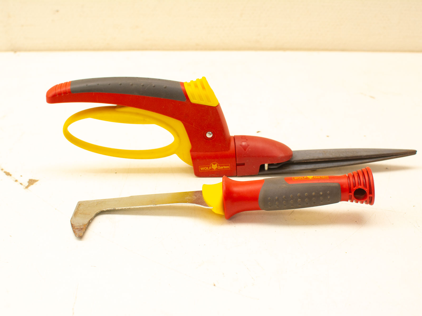 Vintage WOLF Garten red and yellow gardening tools: ergonomic shears and durable weeding tool.