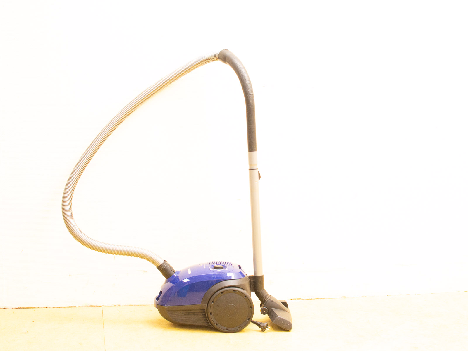 Sleek blue vacuum cleaner with flexible hose and ergonomic nozzle for efficient home cleaning.