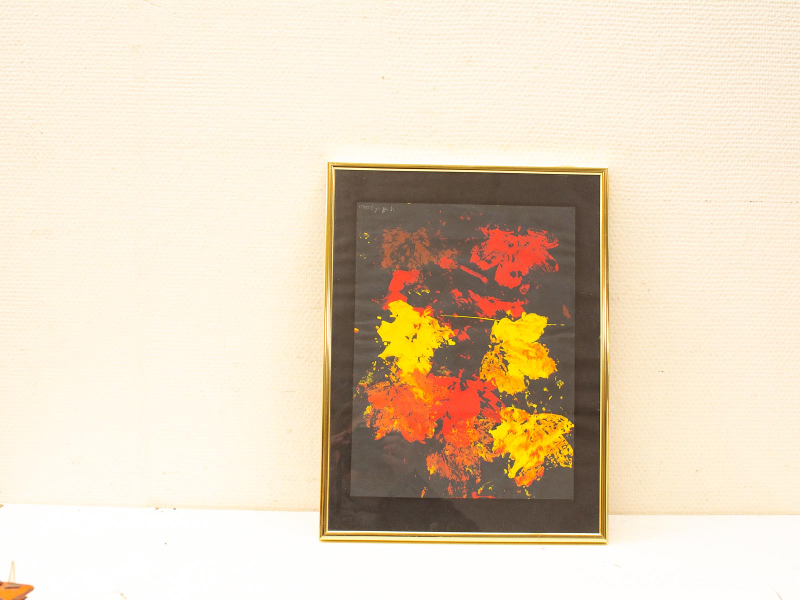 Dynamic abstract art featuring vibrant reds and yellows on a striking black background.