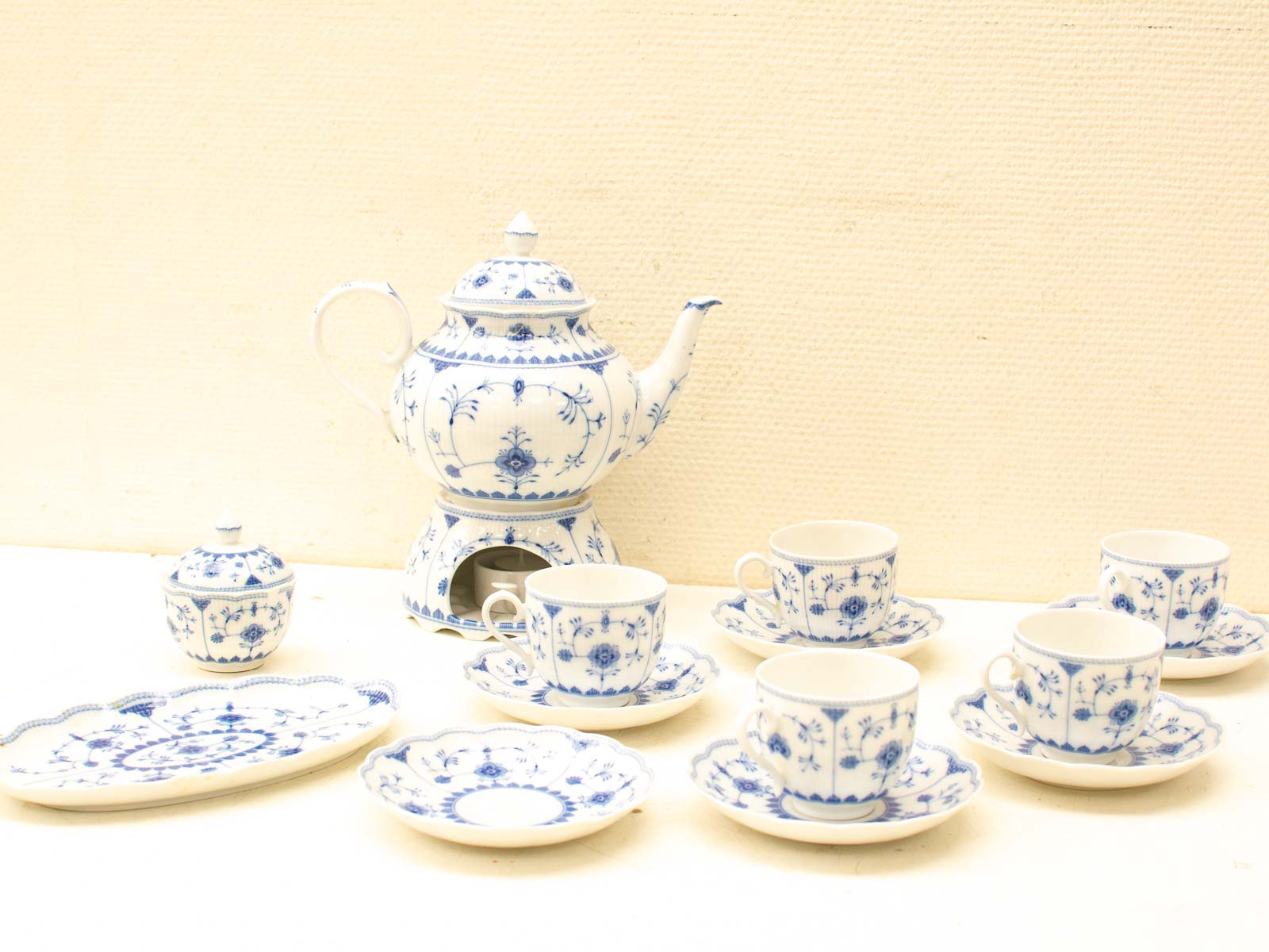 Elegant vintage blue and white floral tea set for a refined tea experience.