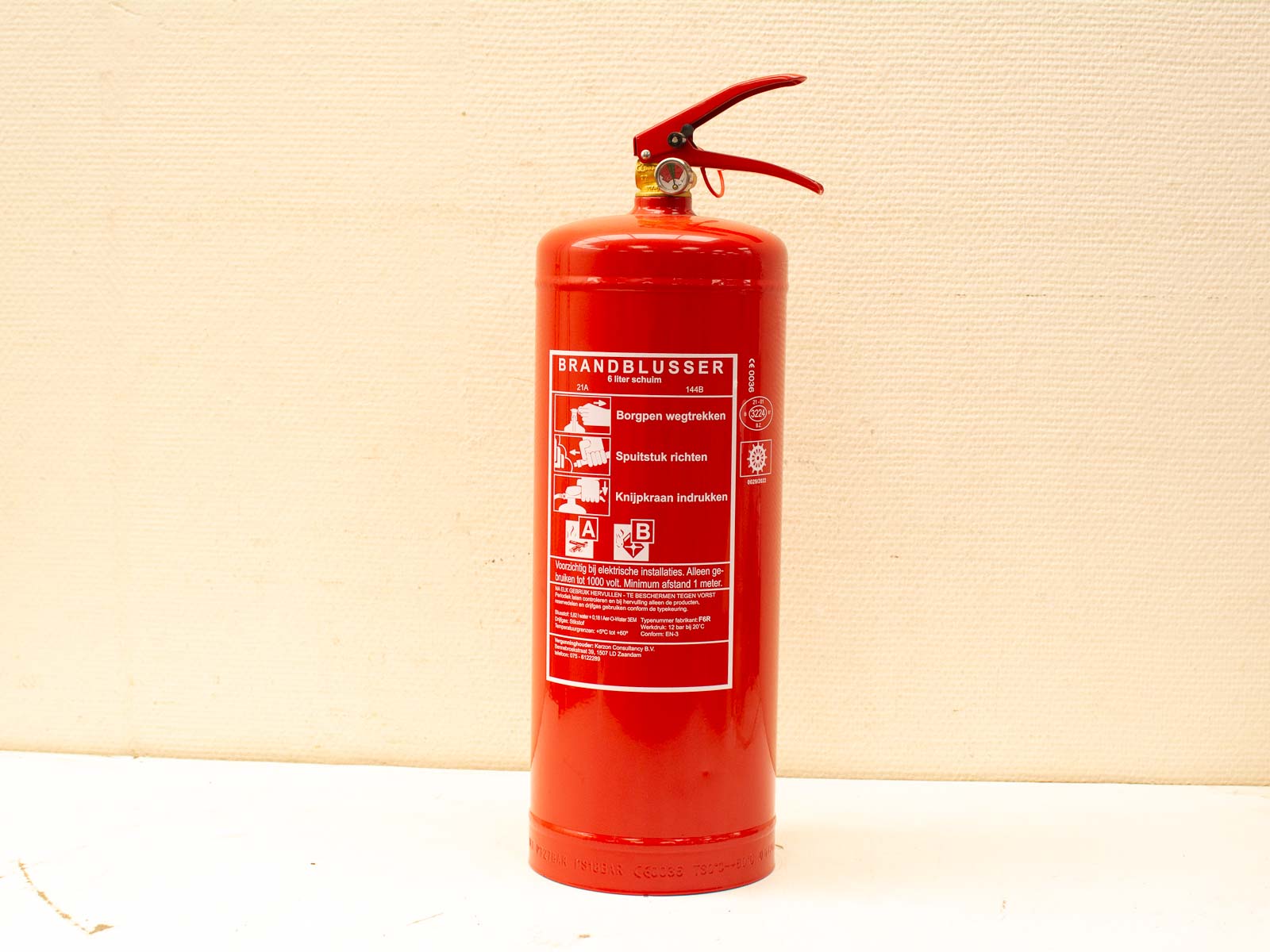 Classic red fire extinguisher for safety, featuring clear instructions and durable design.