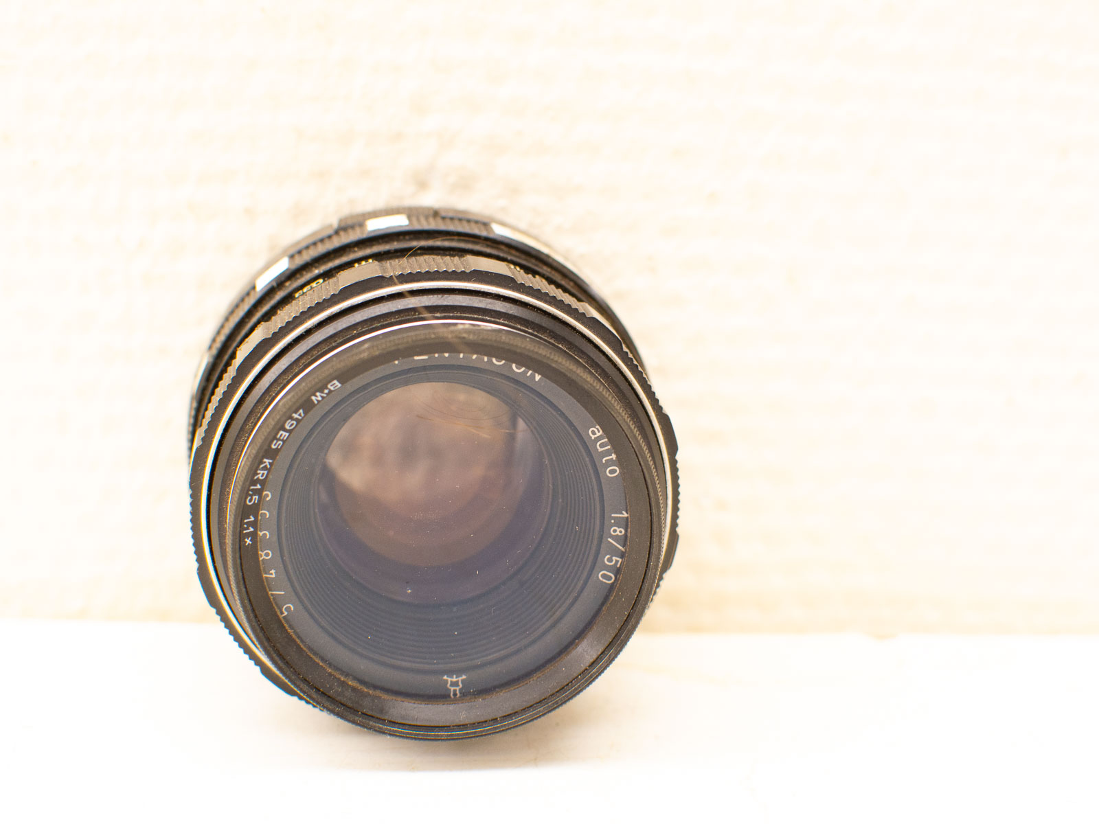 Vintage camera lens with classic design, textured rings, and timeless appeal for photography enthusiasts.