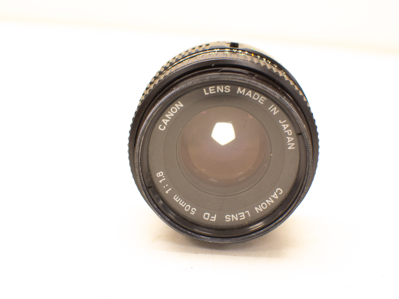 Vintage Canon 50mm f/1.8 lens, perfect for portraits and low-light photography.