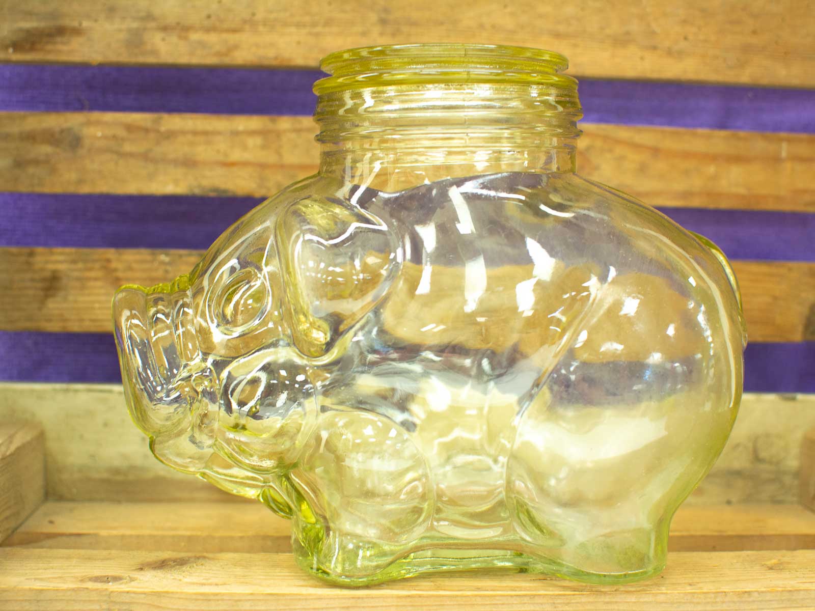 Charming vintage pig jar for storage and decoration, adding whimsy to any space.