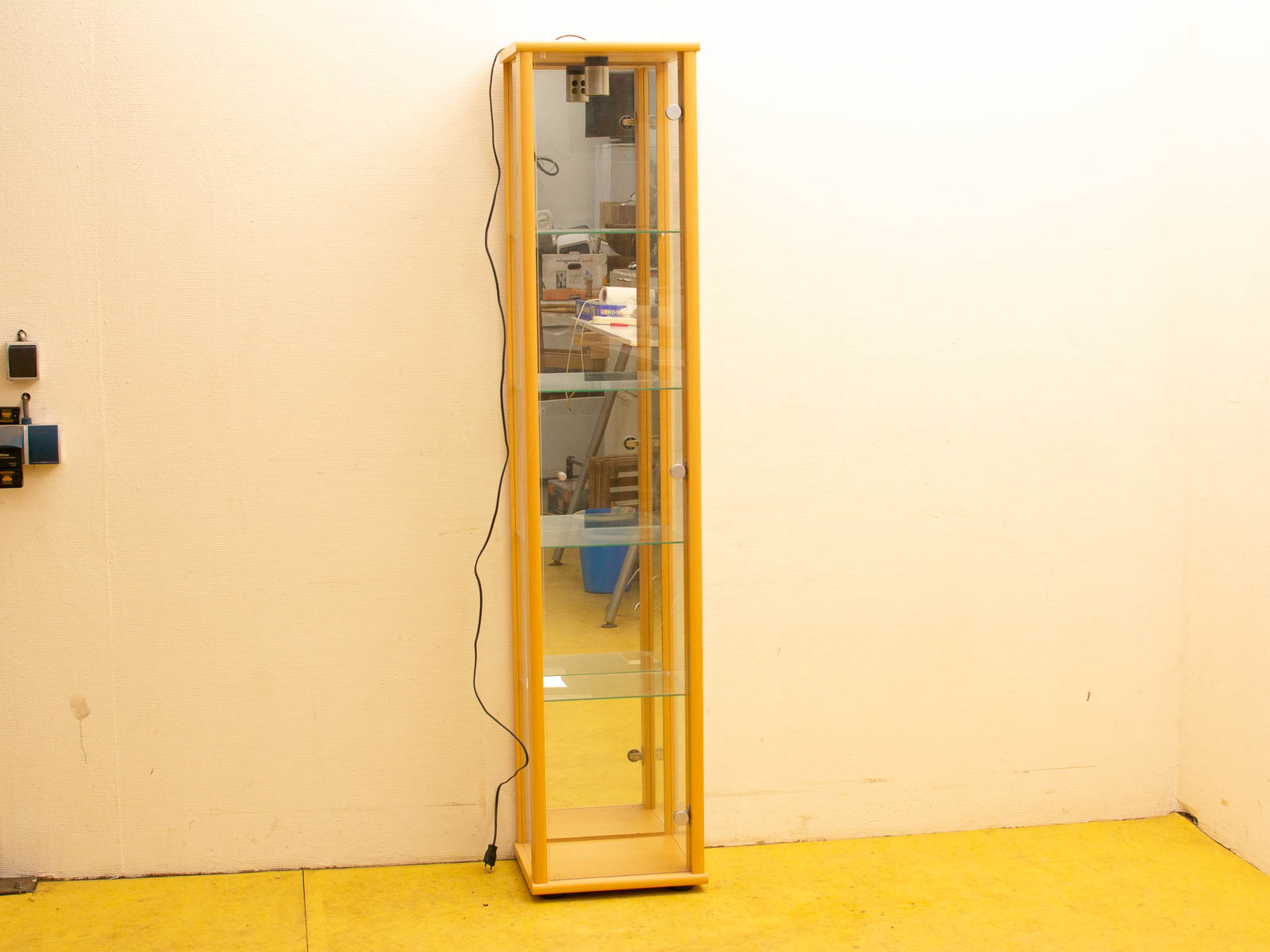 Elegant wooden display case with glass shelves, perfect for showcasing collectibles in any space.