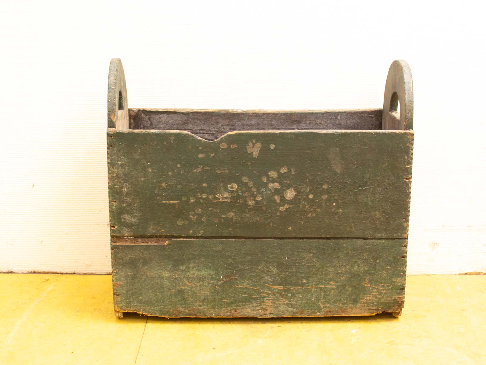 Weathered green wooden storage box with rustic charm and handcrafted details. Perfect for home decor.