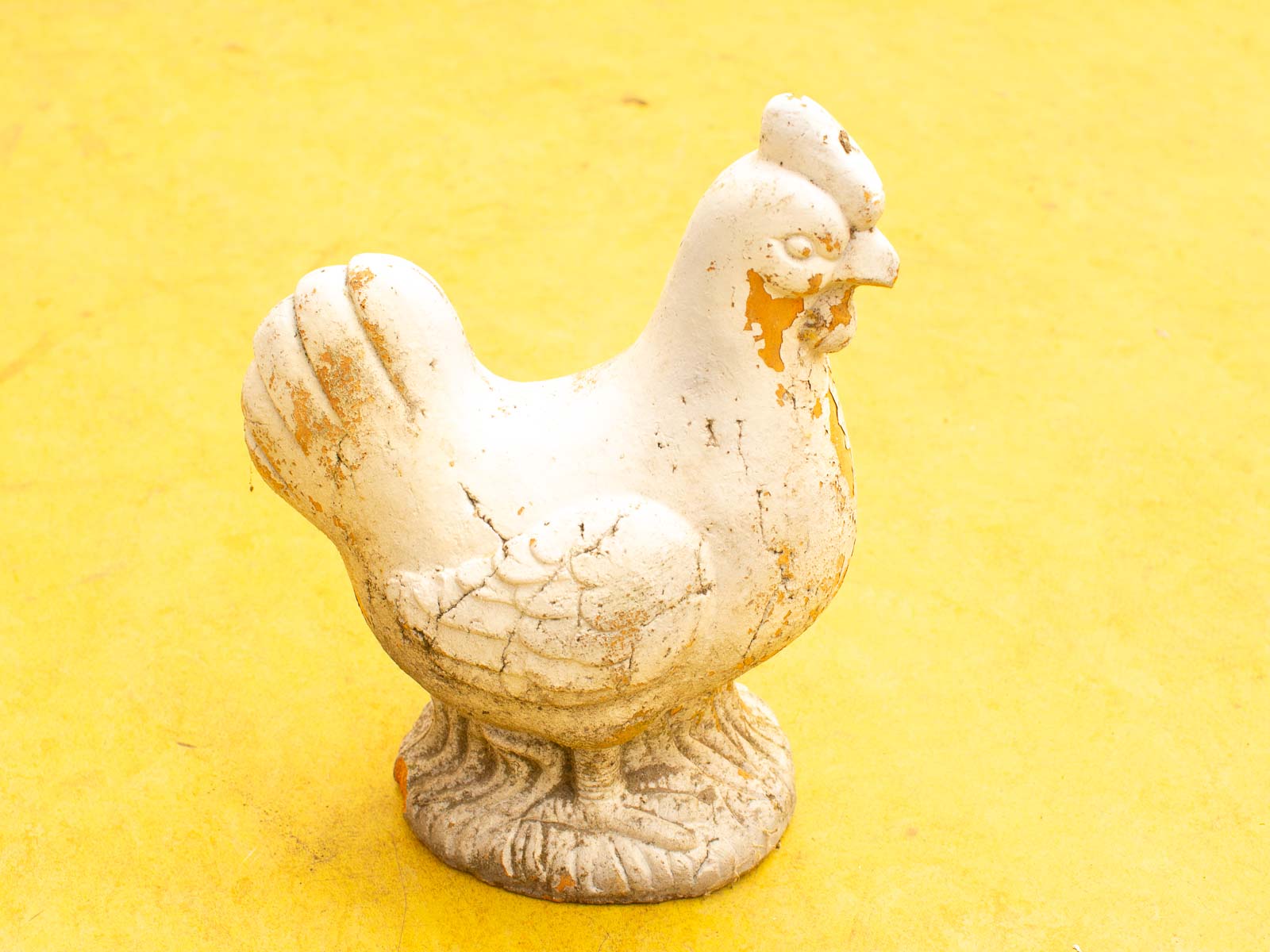 Charming vintage ceramic chick figurine with patina, perfect for nostalgic decor in any space.