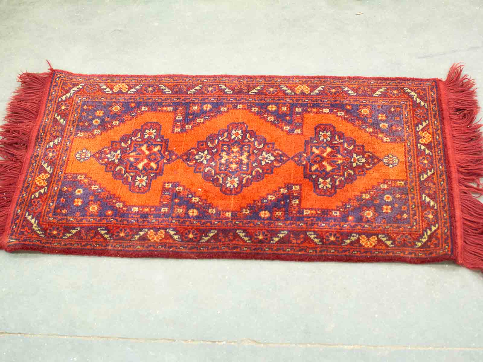 Vibrant vintage geometric area rug with rich colors, perfect for adding warmth and character.