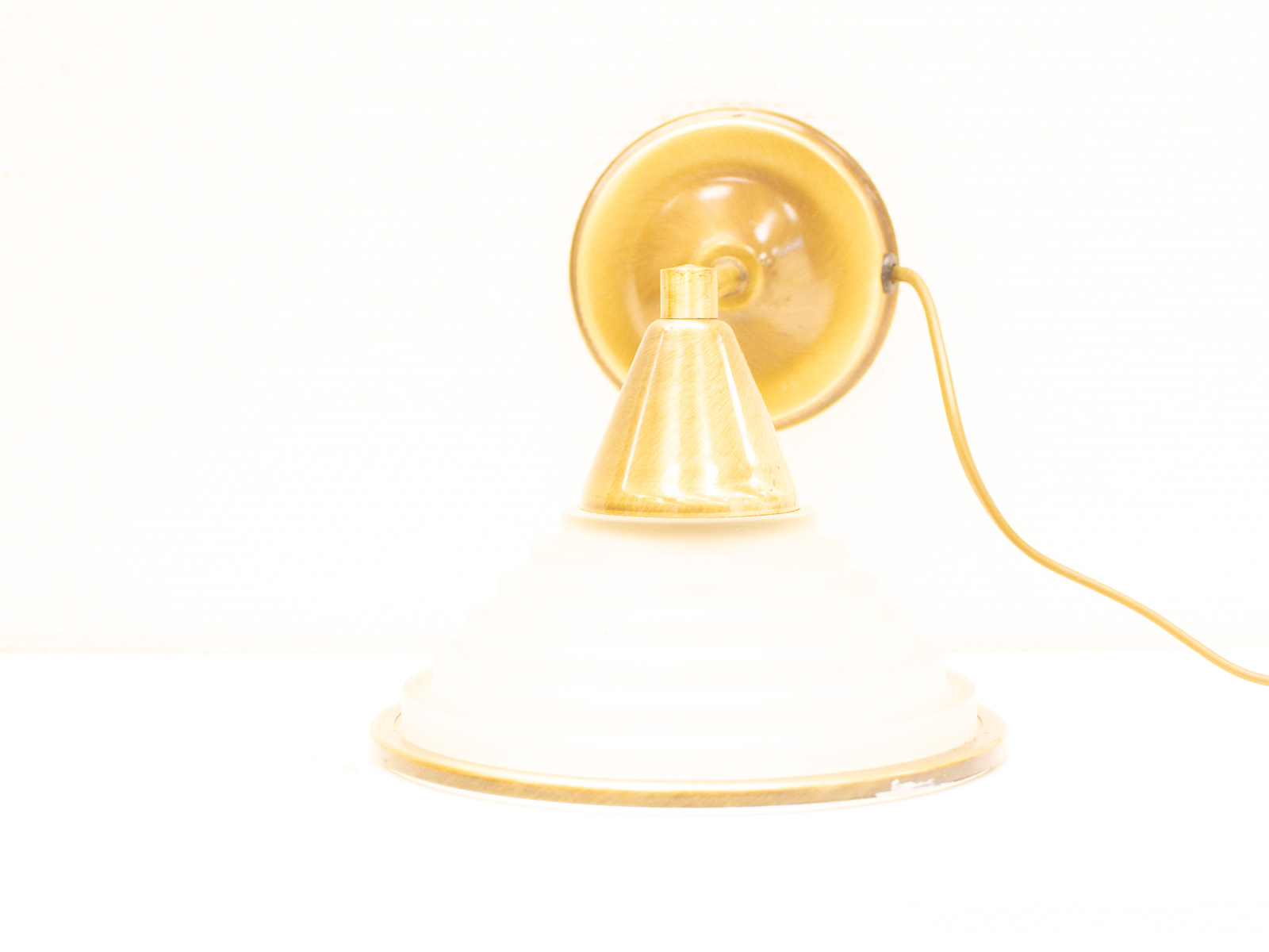 Stylish retro golden table lamp with frosted glass shade, ideal for warm ambiance.