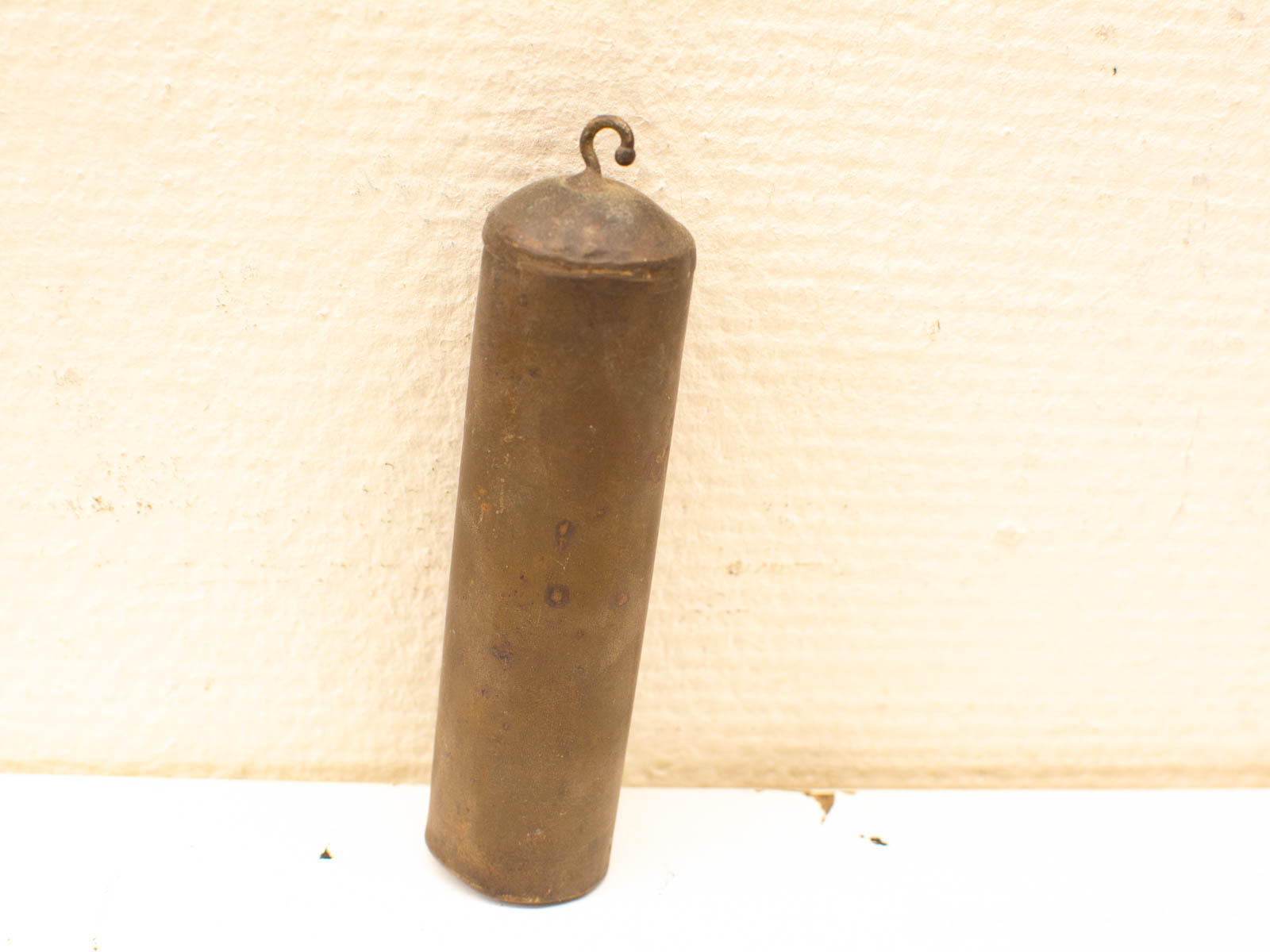 Antique brass bell with patina; ideal for collectors and vintage decor enthusiasts.