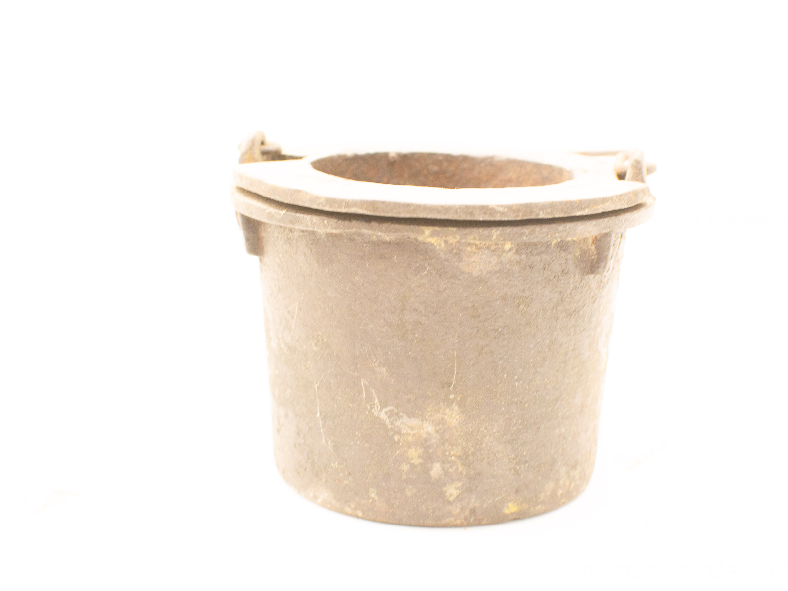 Rustic vintage metal pot with handles, ideal for cooking or as a decorative planter.