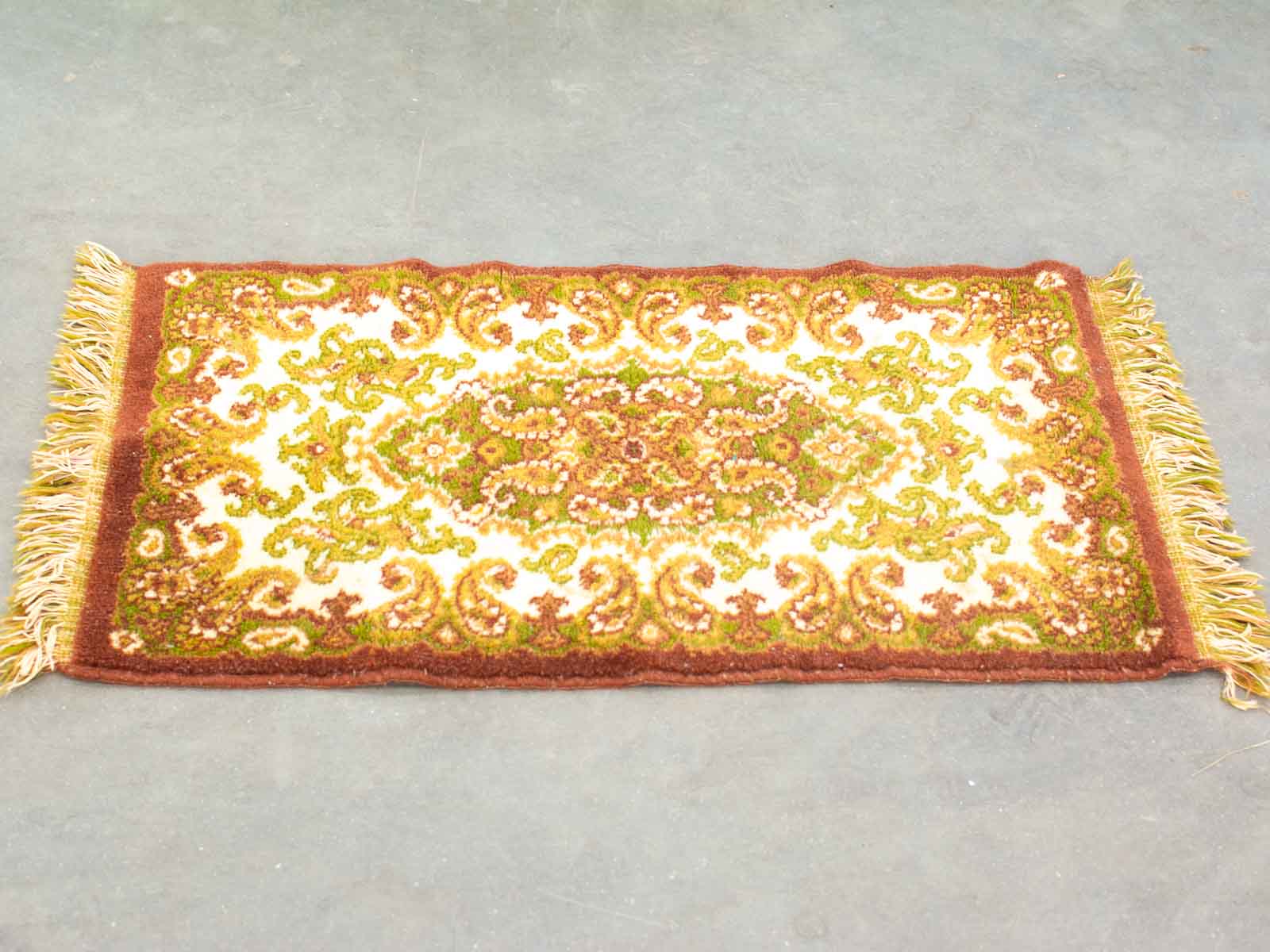 Elegant vintage paisley floral rug in vibrant colors, perfect for timeless decor.