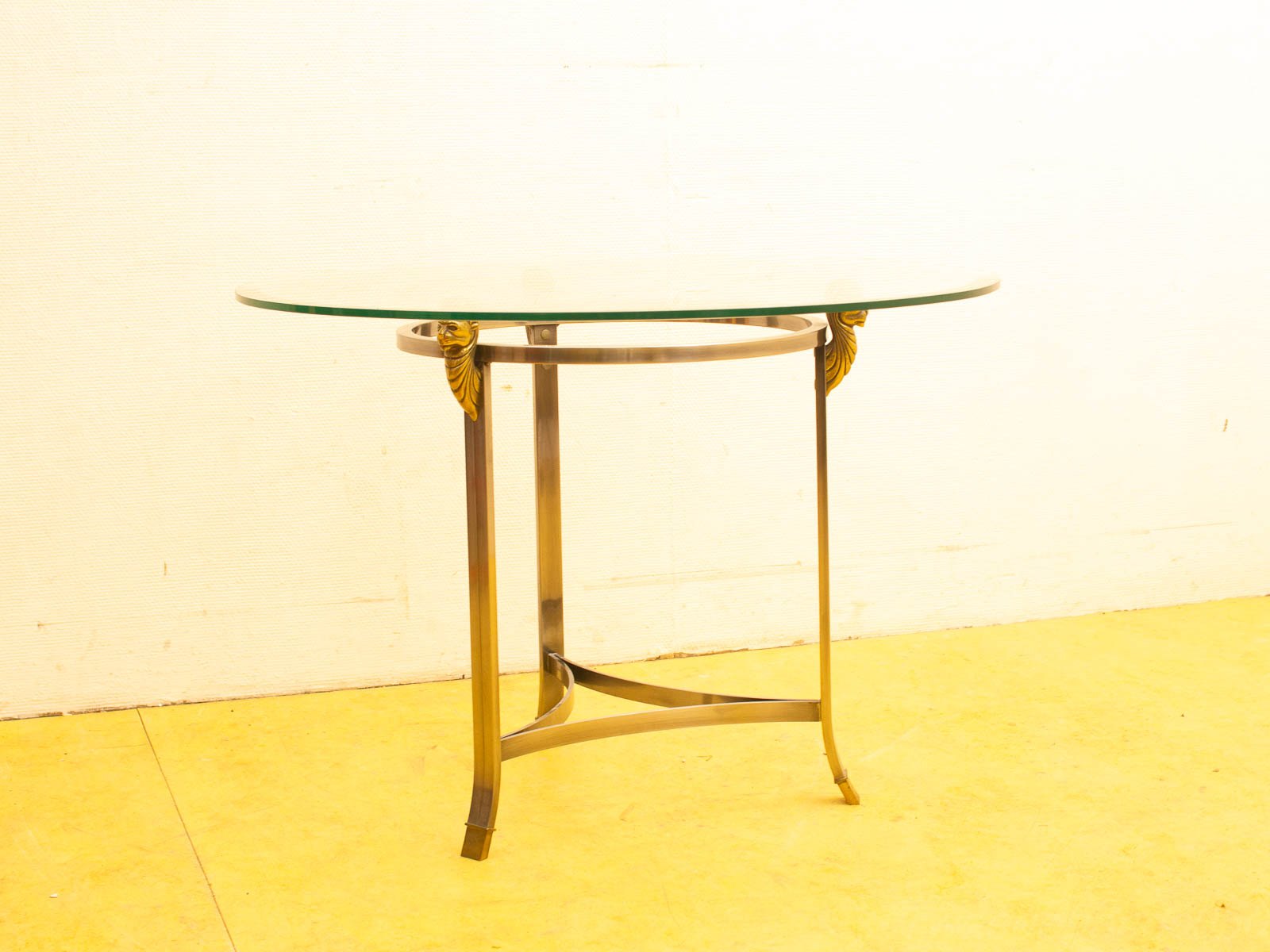 Elegant console table with glass top and gold accents, perfect for modern interiors.