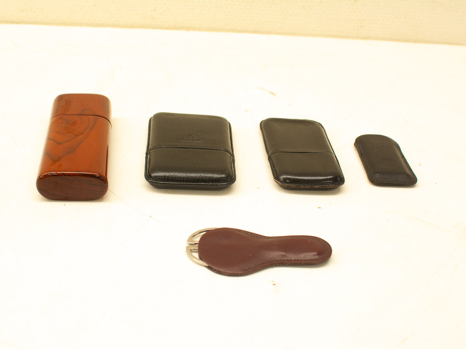 Elegant vintage leather and wood accessory set for stylish organization and timeless design.