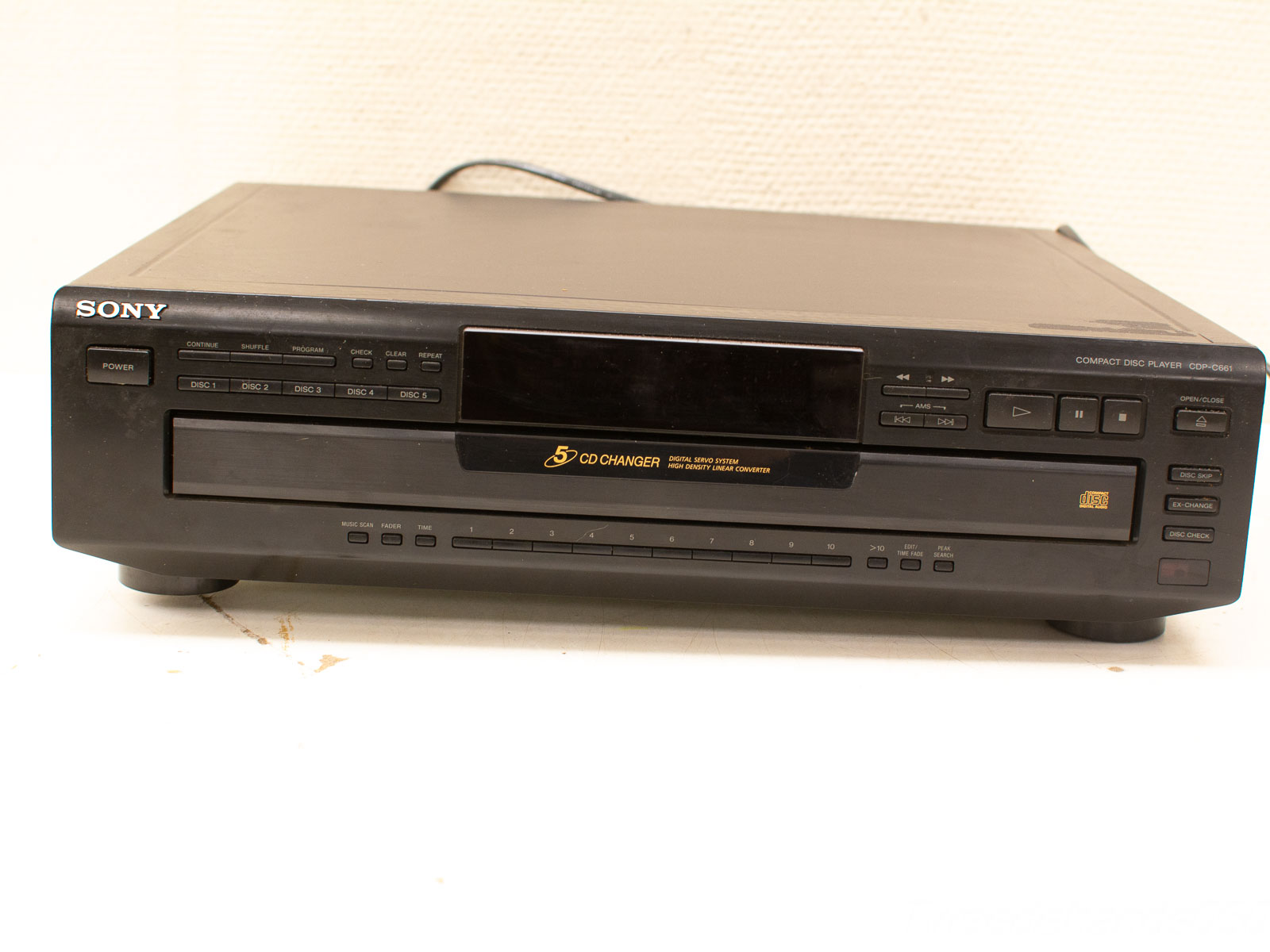 Vintage Sony CD changer CDP-C661: sleek black design with intuitive controls for music lovers.