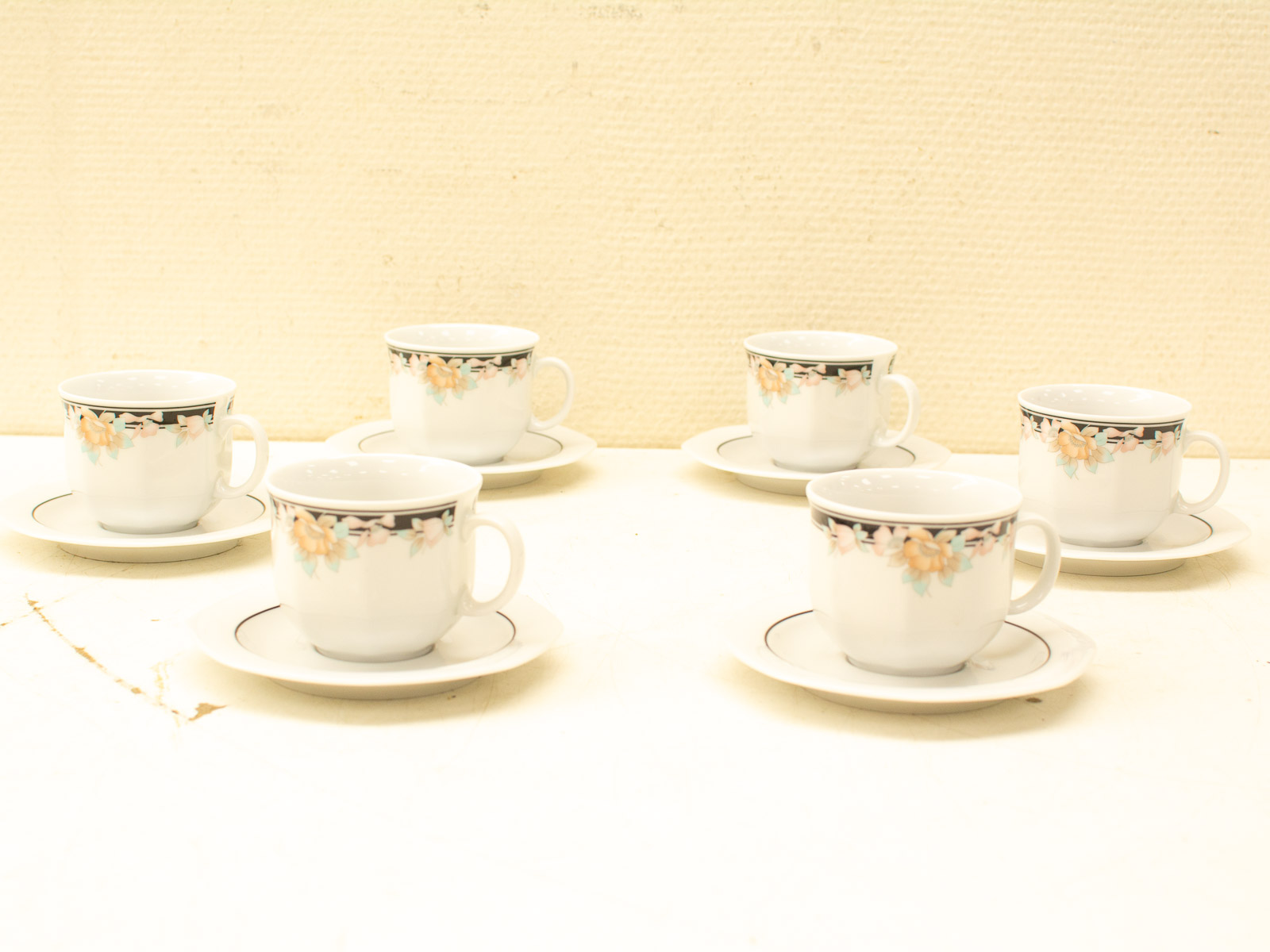 Elegant vintage porcelain teacups with floral design, perfect for sophisticated tea gatherings.