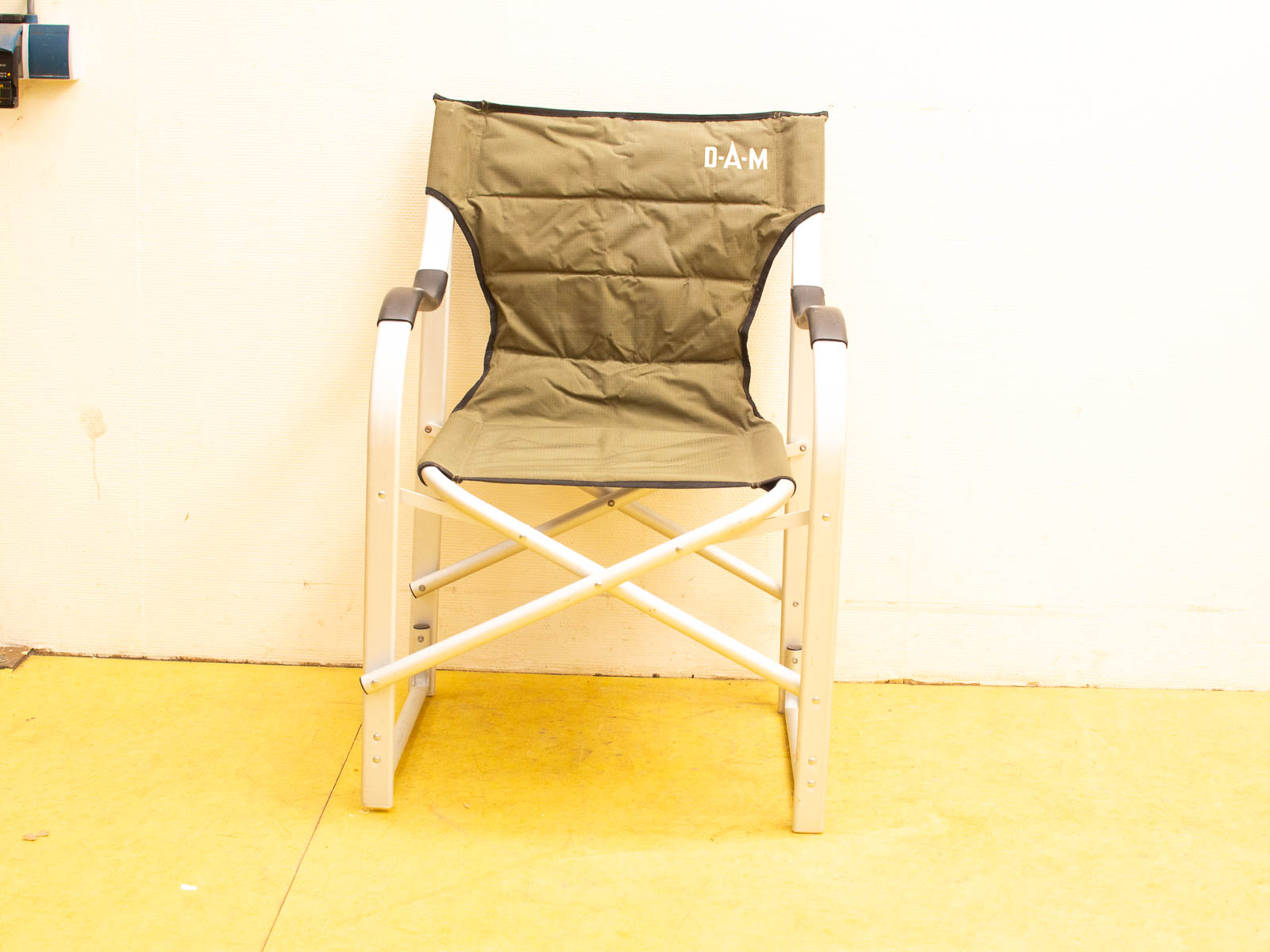 Stylish olive green folding chair with metal frame, perfect for versatile indoor and outdoor use.