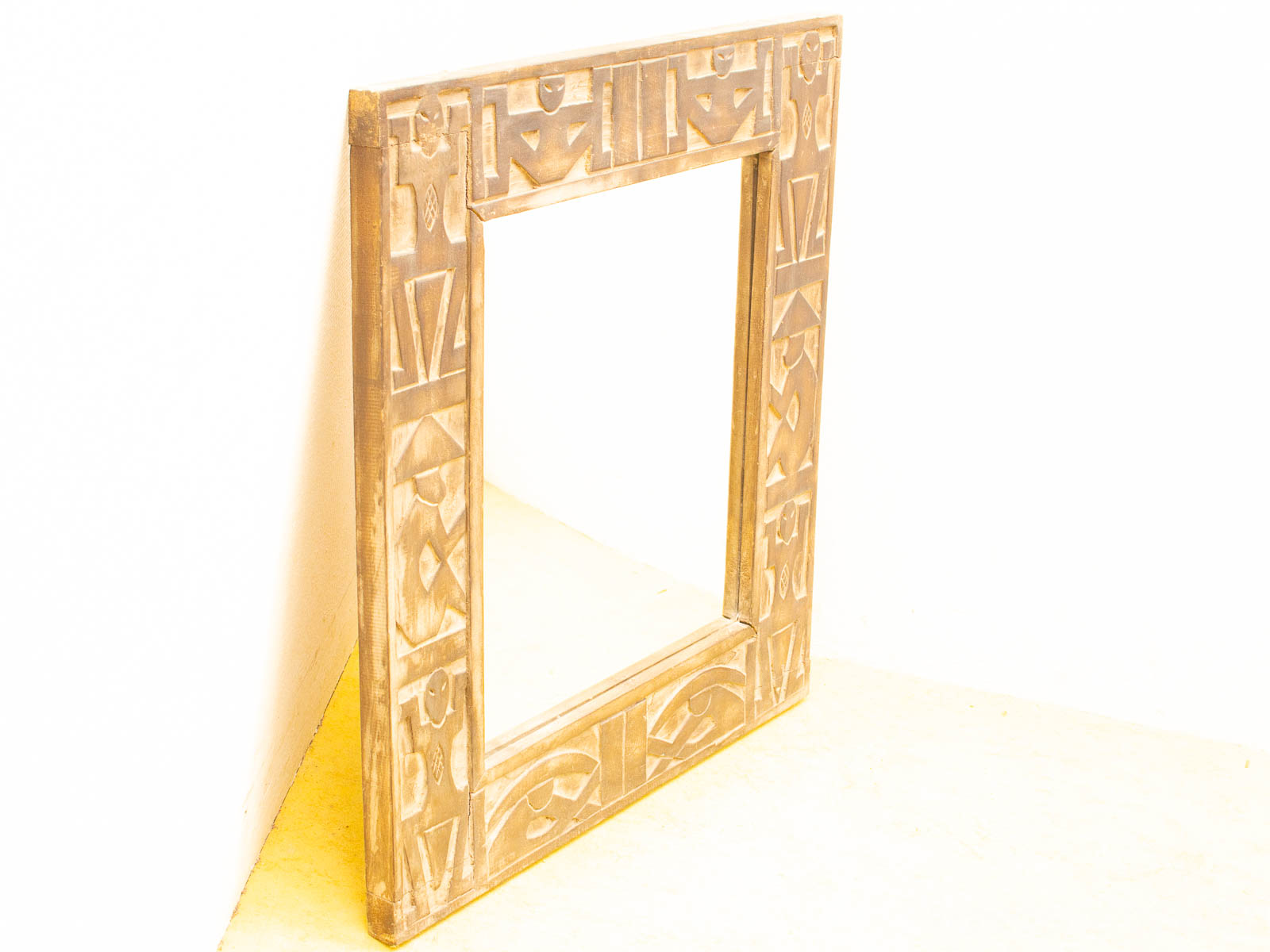 Intricately carved vintage wooden mirror, a stunning focal point for elegant home decor.