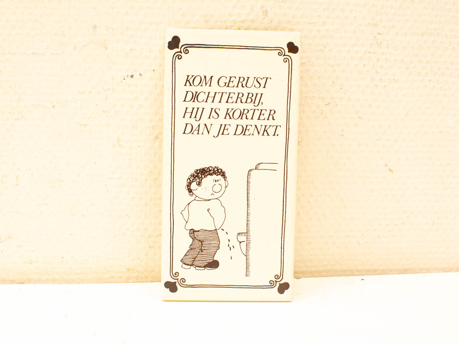 Playful card featuring a chubby boy humorously inviting you to explore surprises up close.