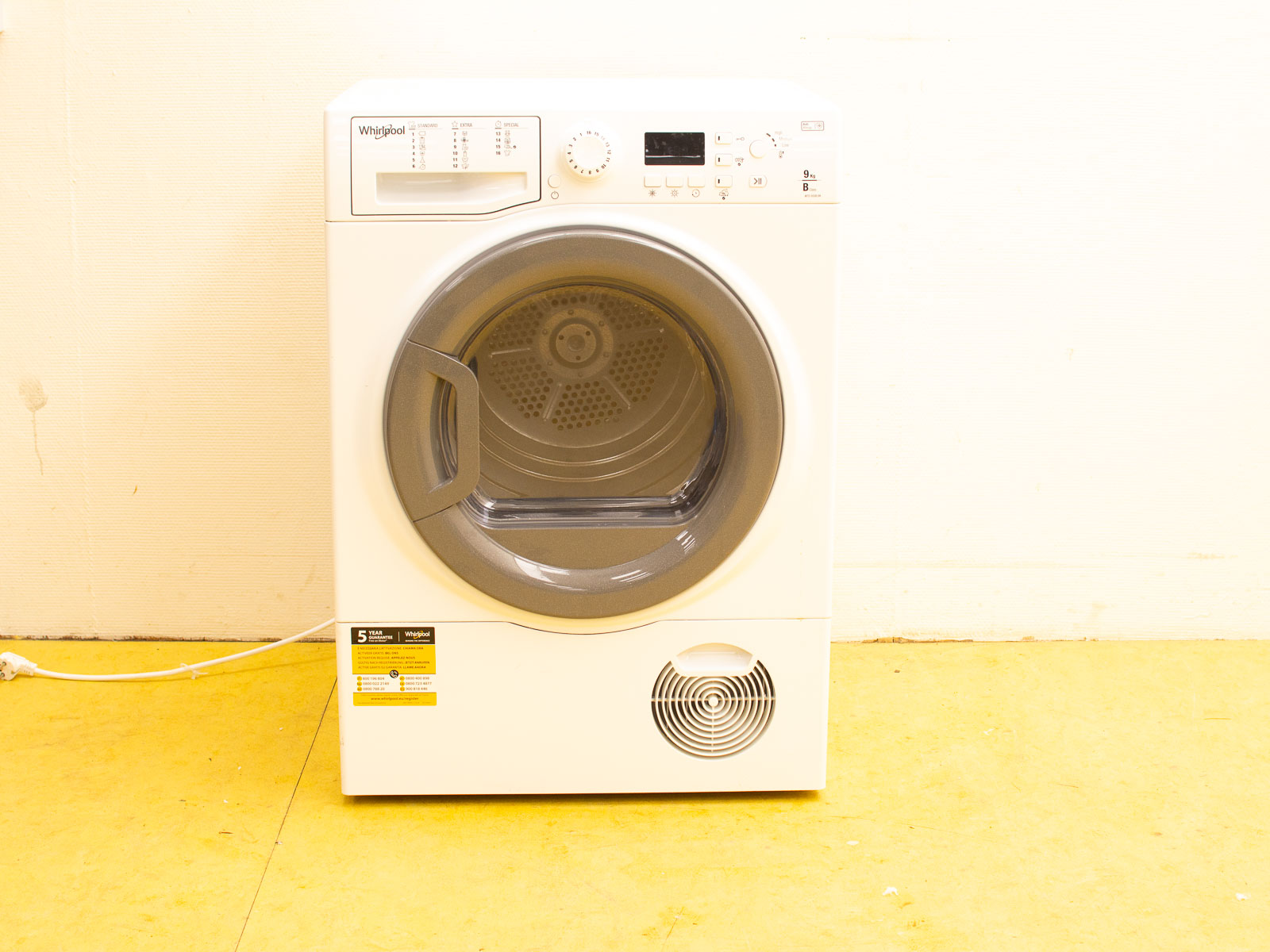 Sleek modern white dryer with digital controls, perfect for compact spaces and efficient drying.