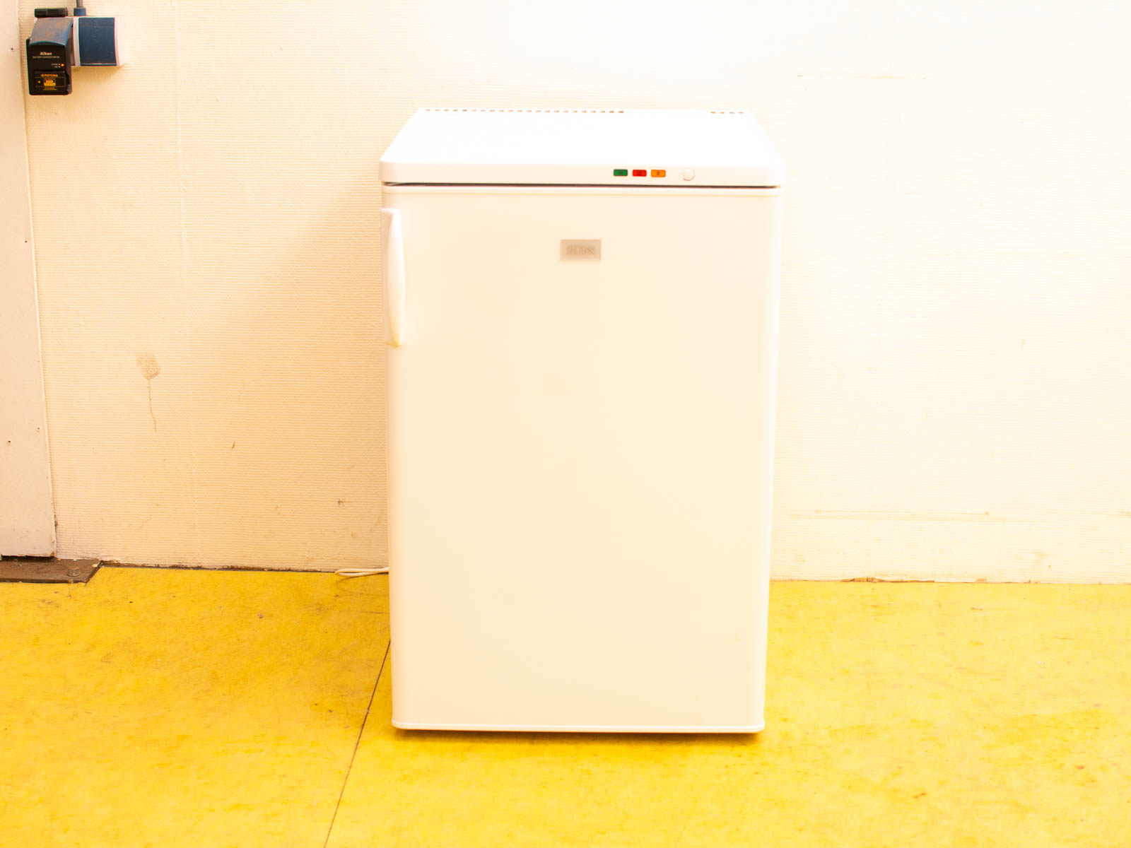 Stylish vintage white refrigerator, compact design perfect for kitchens and small spaces.