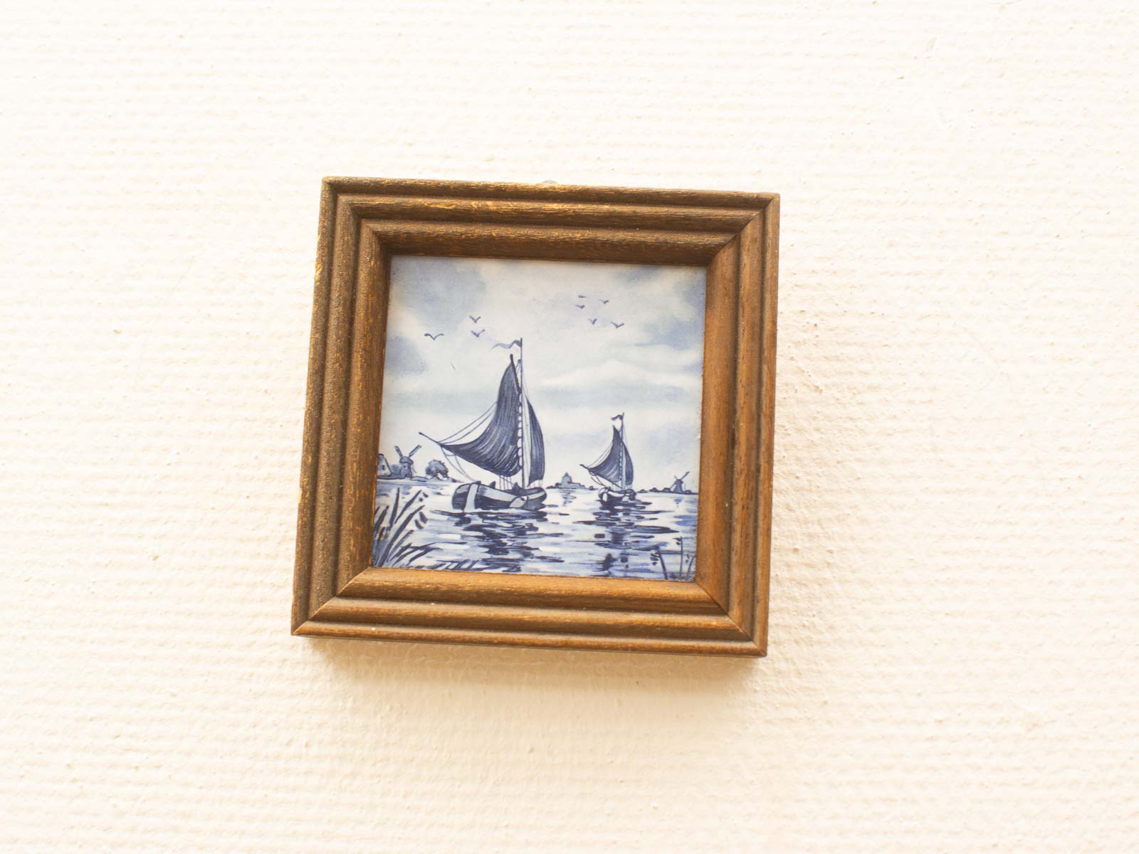 Serene sailboats on calm waters, beautifully framed, perfect for tranquil home decor.