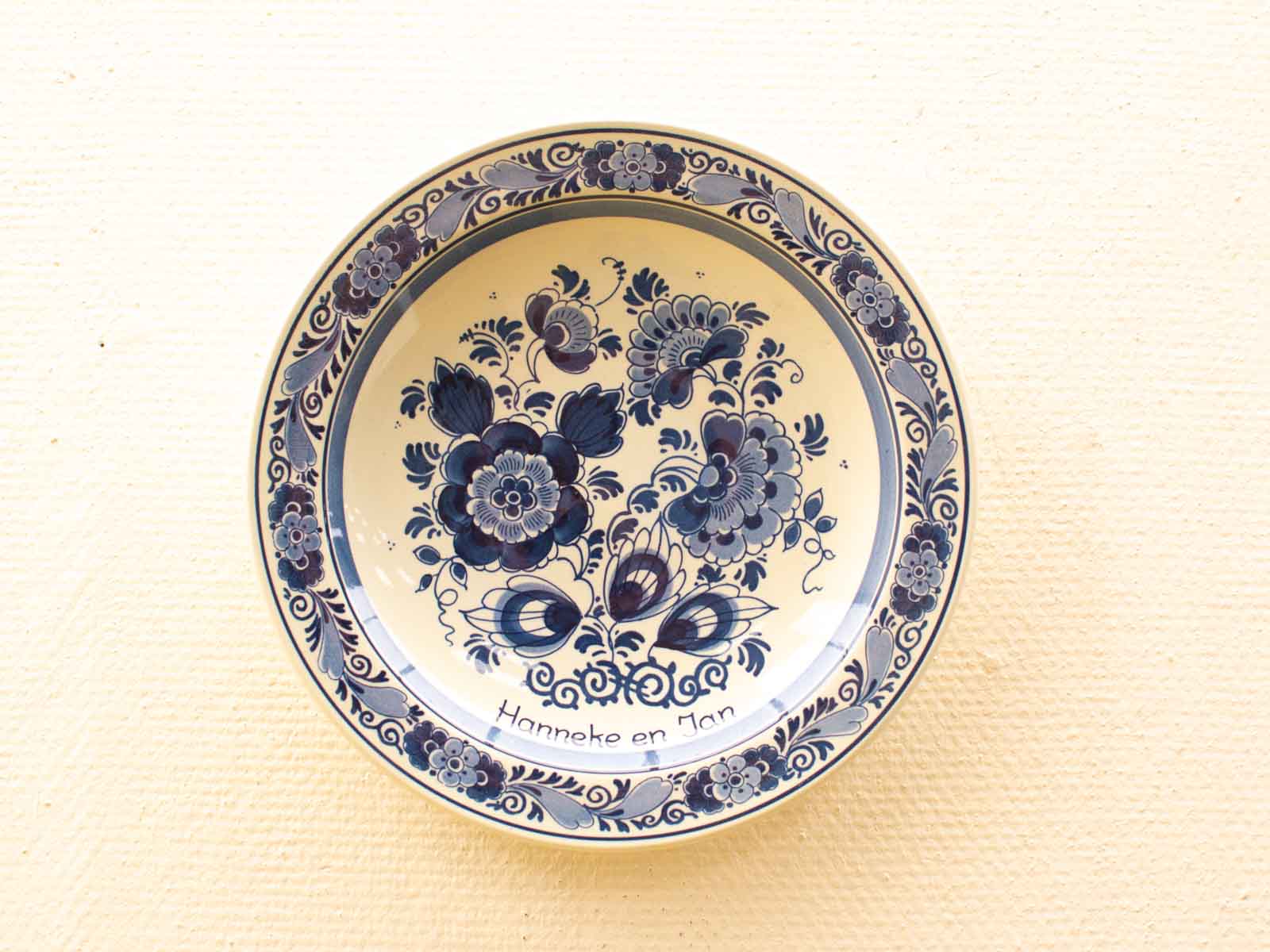 Unique handmade ceramic plate with intricate blue floral design, a sentimental gift for Hanneke and Jan.