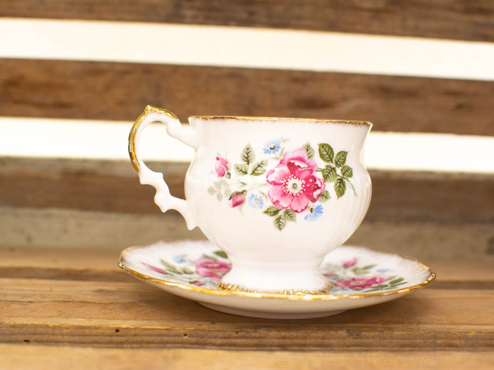 Elegant Vintage Porcelain Teacup with Floral Design and Gold Accents