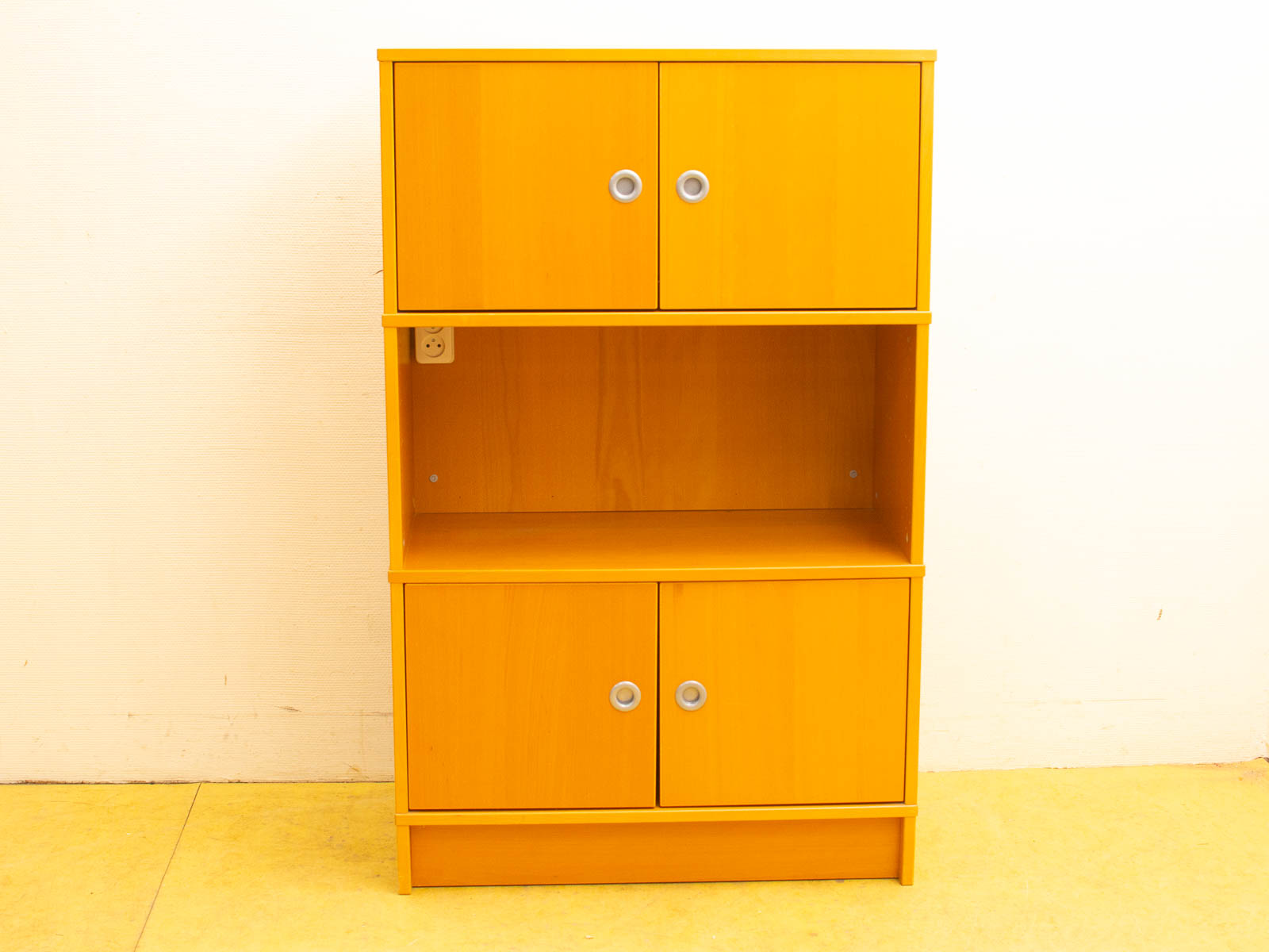 Vibrant yellow modern bookshelf with drawer and compartments for stylish storage and organization.