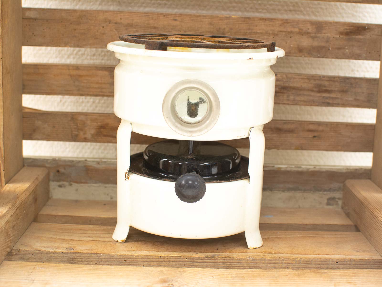 Vintage white electric stovetop with black base, perfect functional retro kitchen décor.