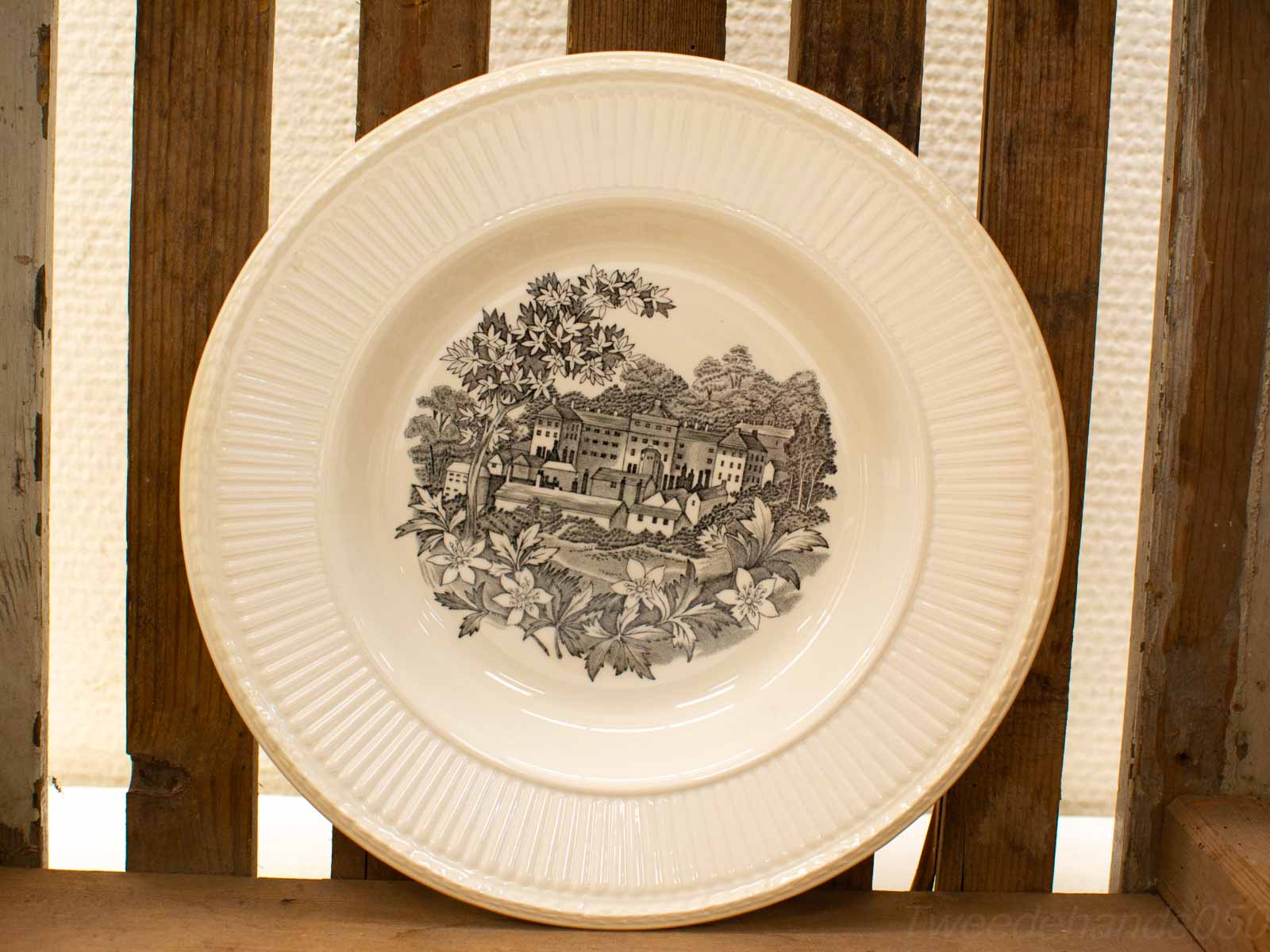 Vintage decorative plate with black-and-white landscape illustration, perfect for rustic home decor.