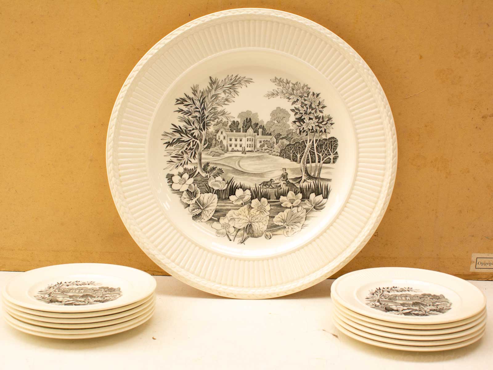 Elegant vintage dishware set with black-and-white nature illustrations for sophisticated dining experiences.