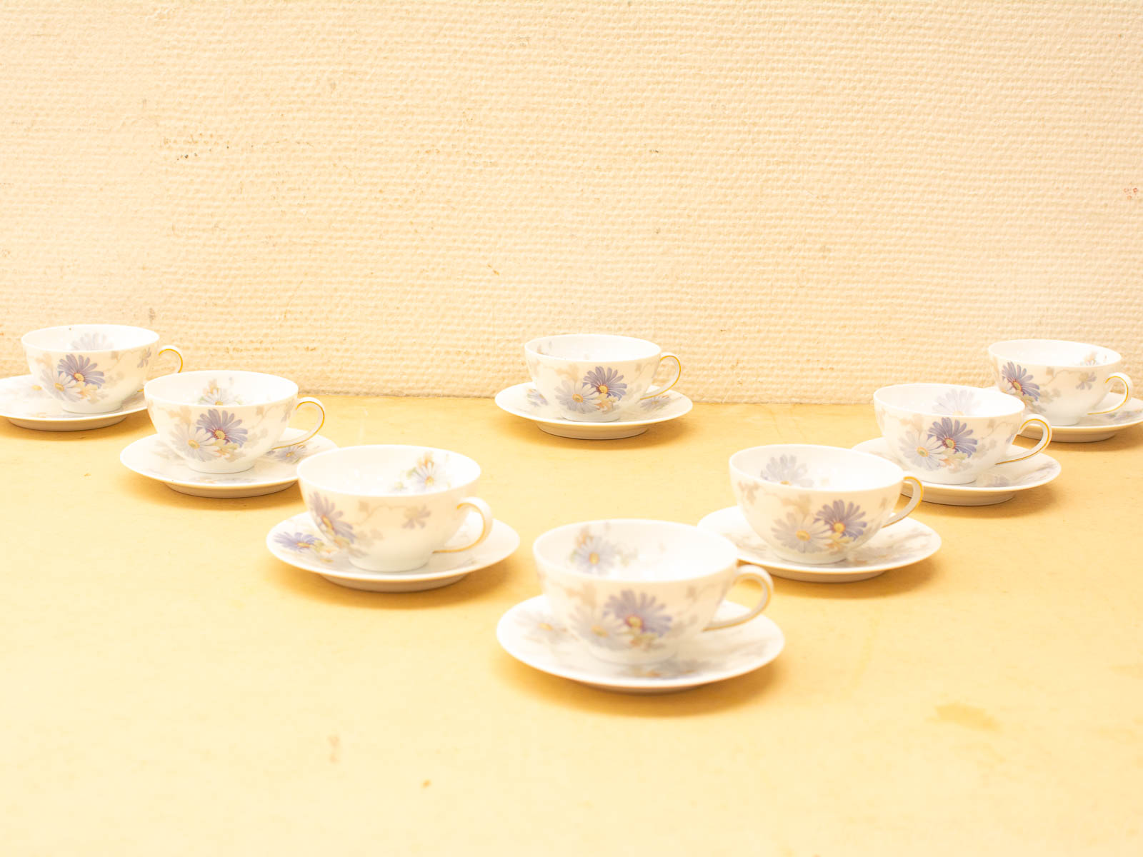 Elegant porcelain tea cups with floral designs, perfect for charming tea gatherings and refined aesthetics.