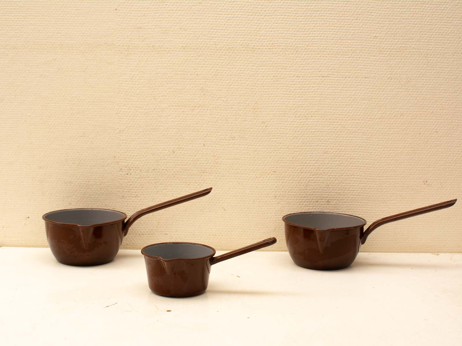 Modern brown kitchen pots set showcasing a blend of elegance, functionality, and minimalist design.