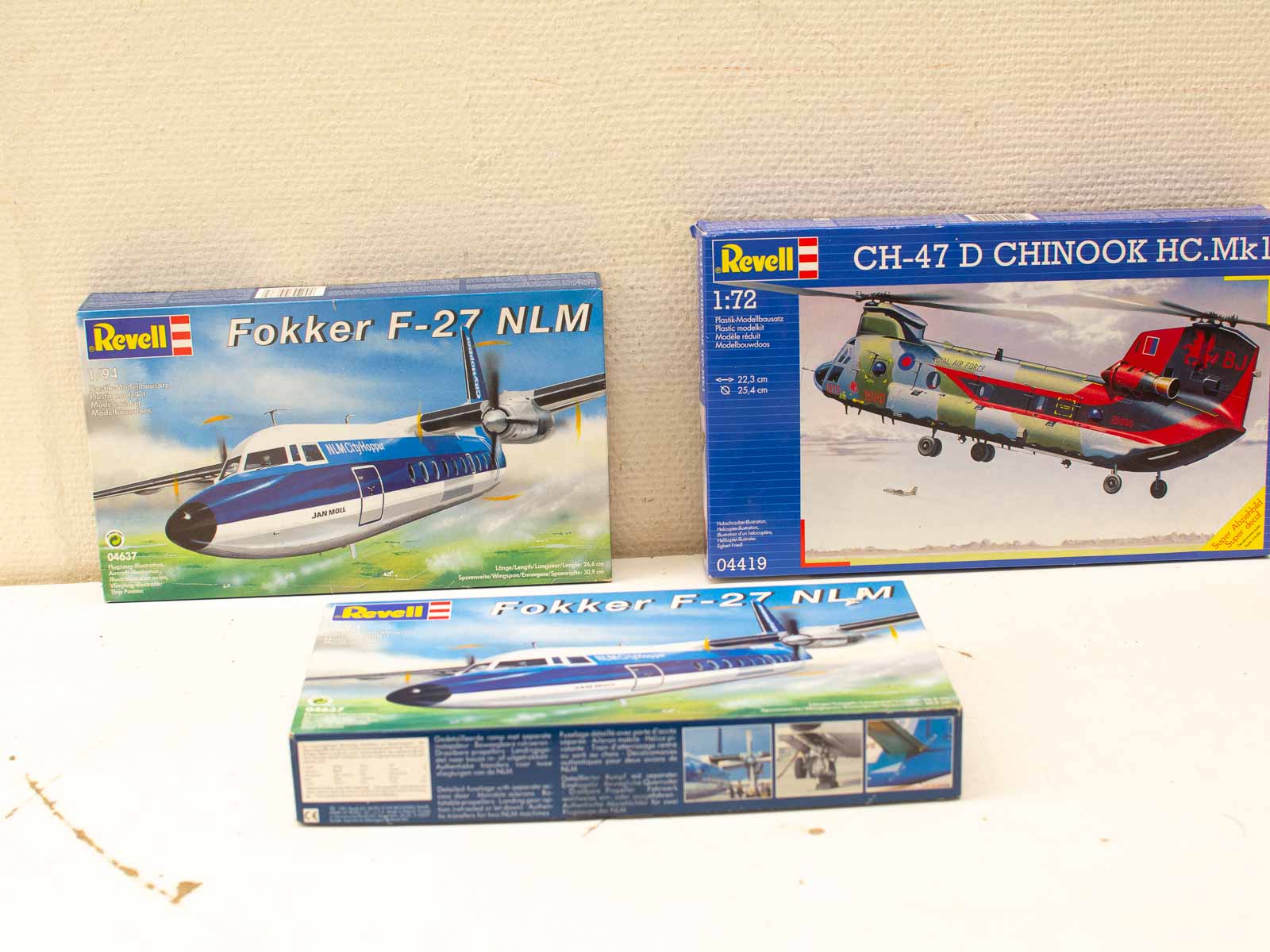 Revell Fokker F-27 and CH-47 Chinook model kits displayed on a light surface.