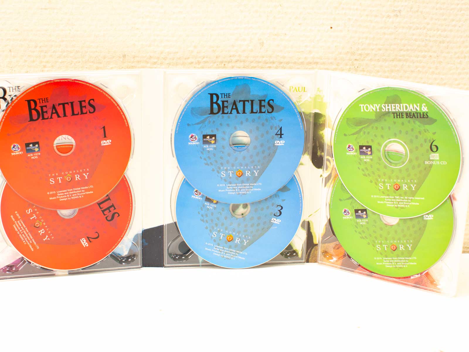 The Beatles Complete Story Disc Set: A colorful collection celebrating the bands legendary journey.