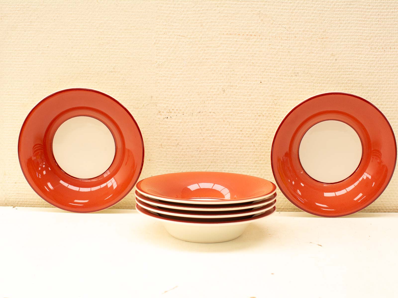 Charming red and cream dishware set, perfect for stylish dining occasions, casual or formal.