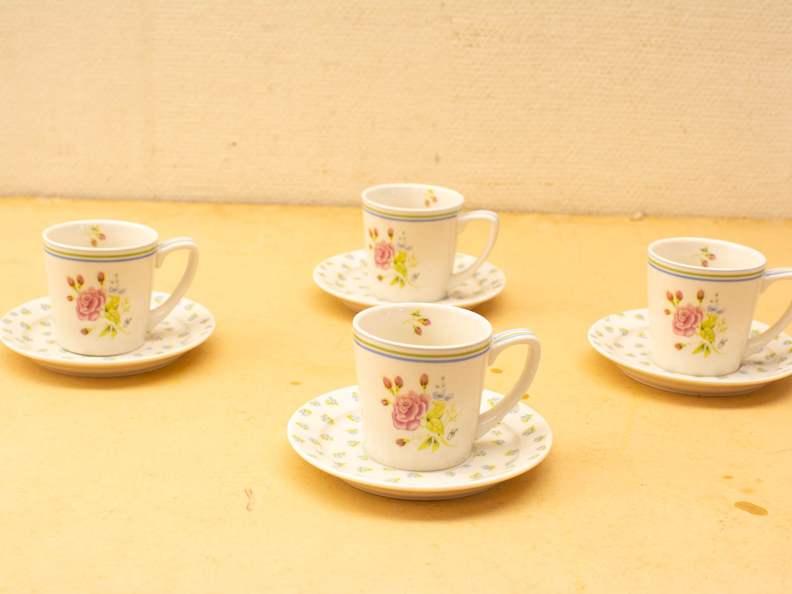 Charming porcelain tea cups with floral designs, perfect for elegant tea parties and gatherings.