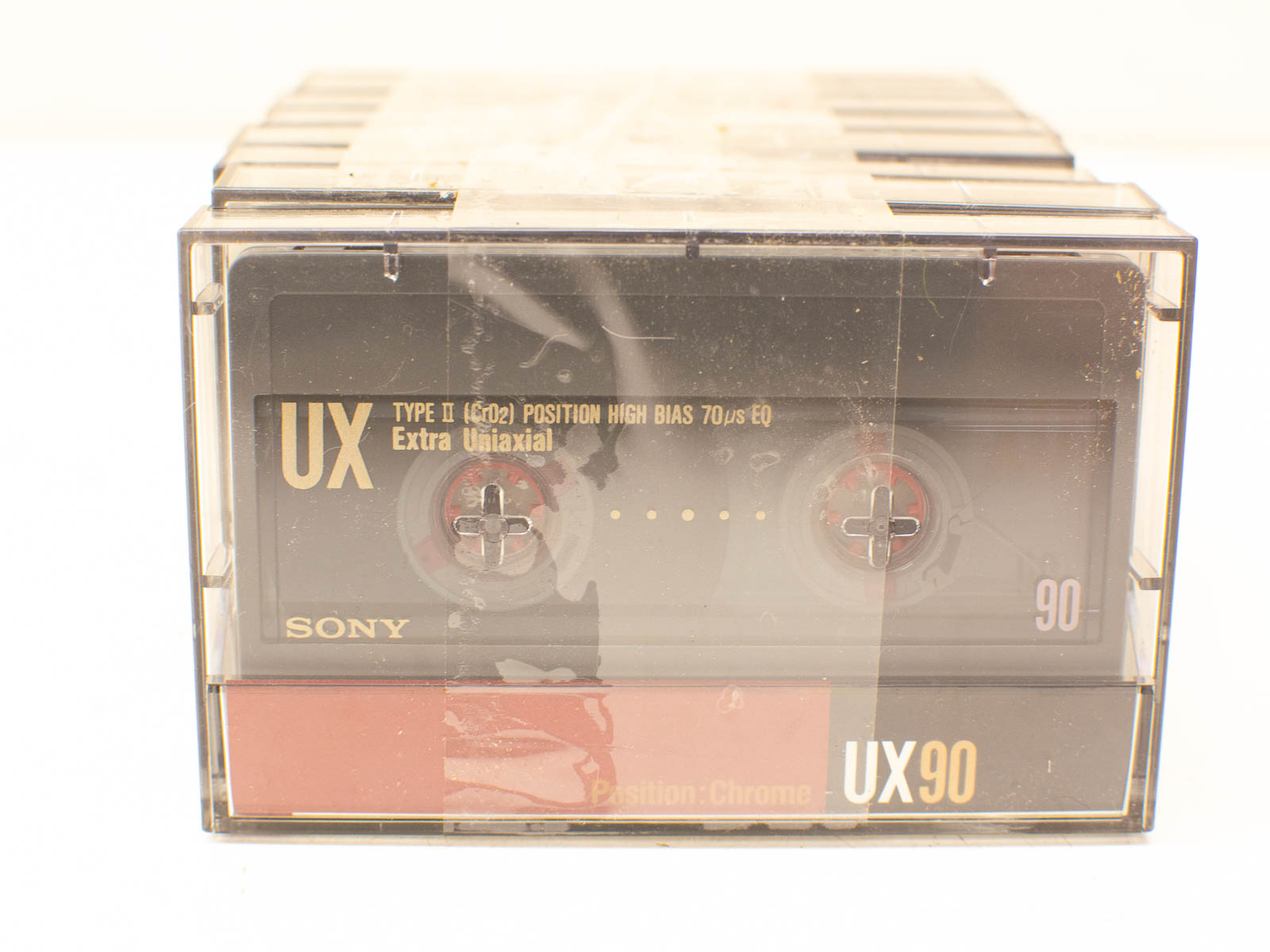 Vintage Sony UX90 cassette tape in a clear case, perfect for high-quality audio recordings.