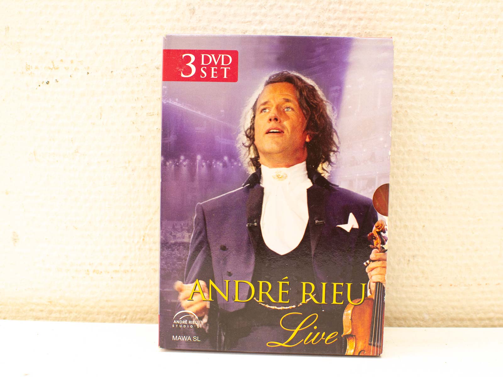 André Rieu: Spectacular Live Concert DVD Collection, showcasing vibrant performances in a stunning purple design.