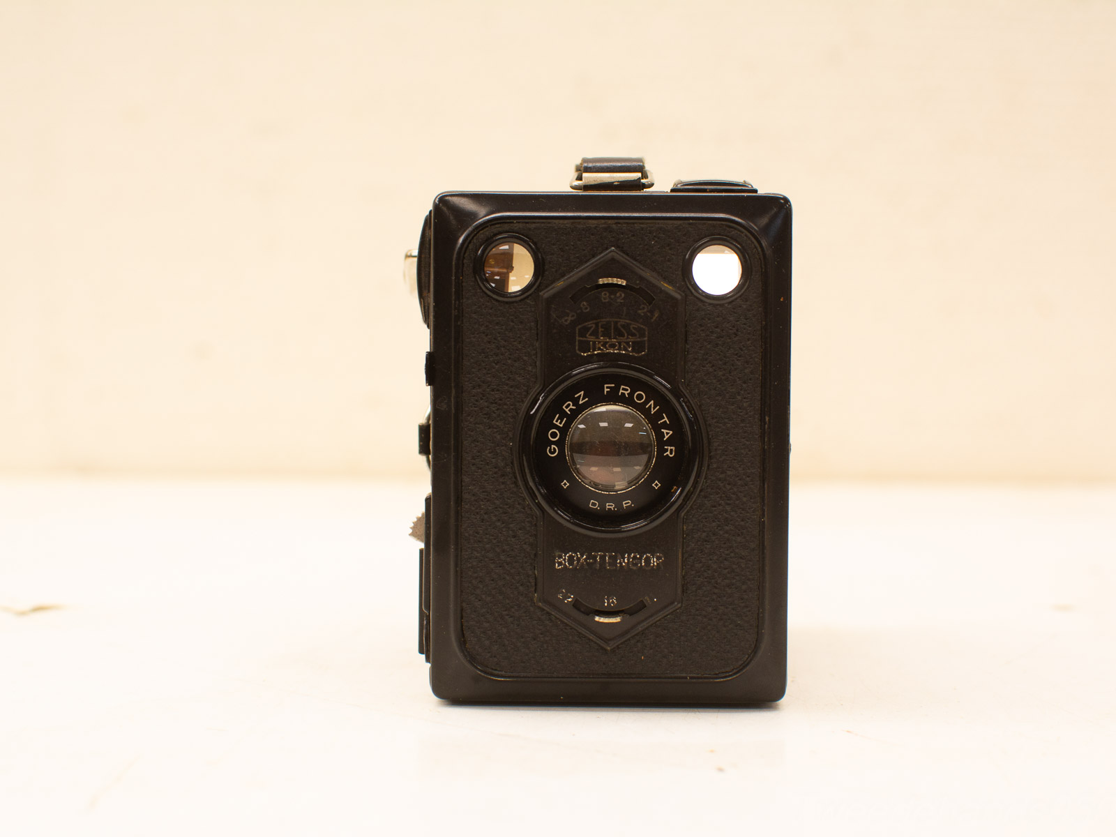 Vintage black box camera with flash and tripod mount, ideal for nostalgic photography experiences.